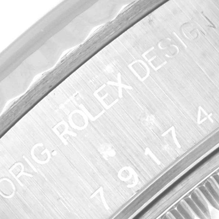 This close-up image shows the engraving on the side of a Rolex Datejust 79174 Women's Stainless Steel Silver Dial 79174 Women's Stainless Steel Silver Dial watch case.