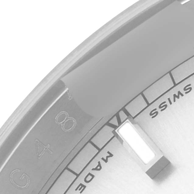This close-up image of a Rolex Datejust 116234 Men's Stainless Steel Silver Dial 116234 Men's Stainless Steel Silver Dial watch shows a portion of the dial, including an hour marker and part of the "Swiss Made" label.