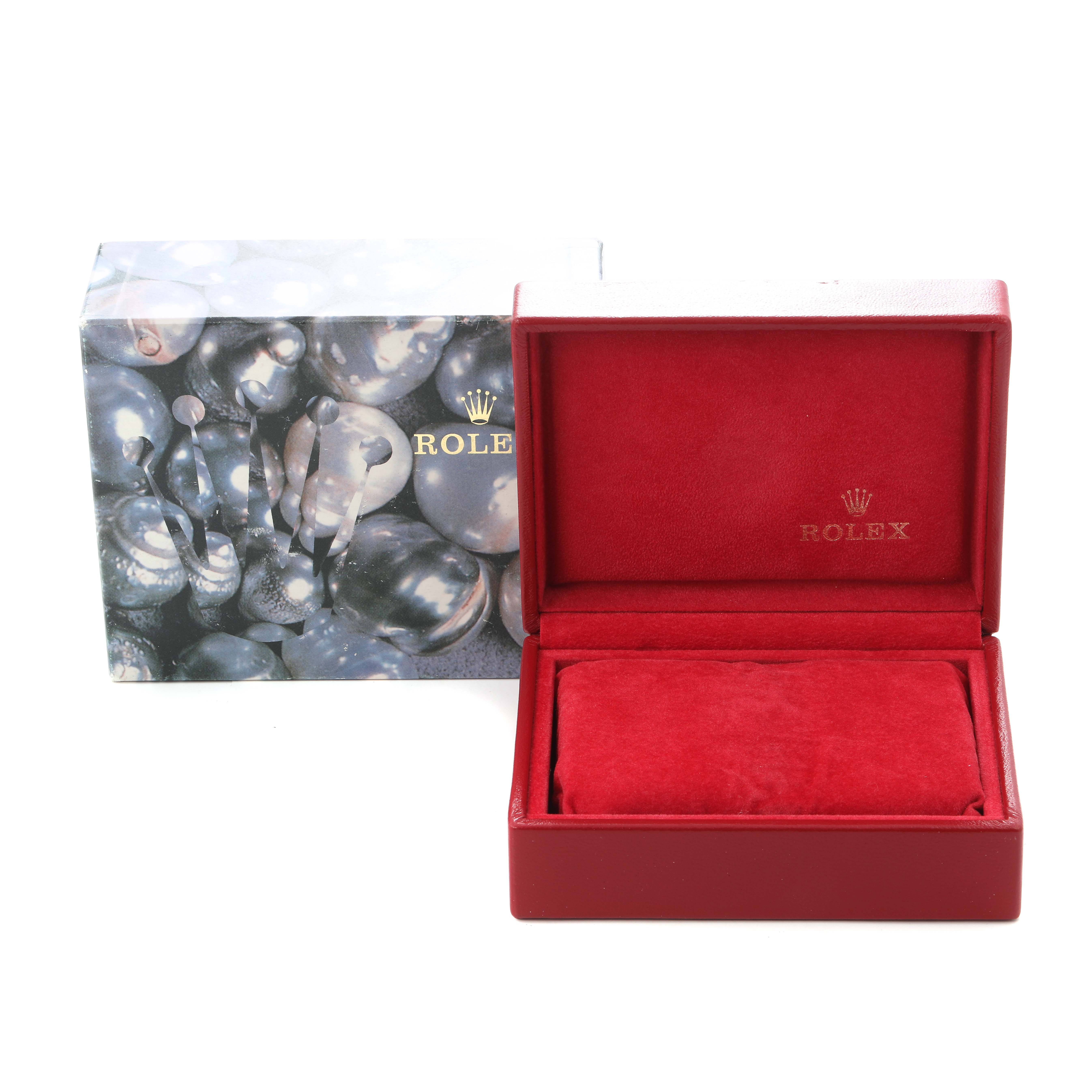 The image shows a Rolex Datejust 79173 Women
s Steel and Gold (two tone) Silver Dial 79173 Women
s Steel and Gold (two tone) Silver Dial watch box and outer packaging, open to reveal the red interior.