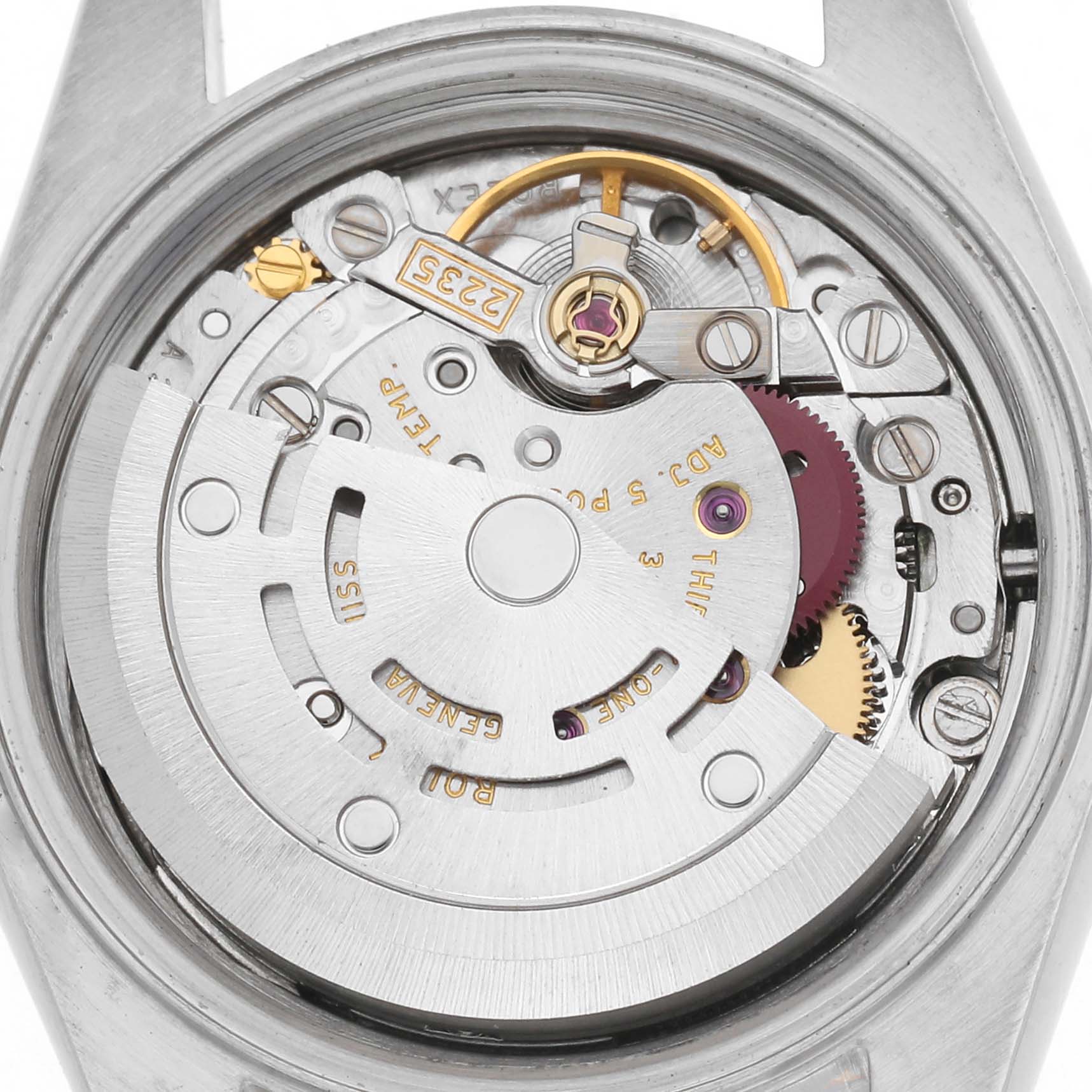 The image shows the movement of a Rolex Datejust 79173 Women
s Steel and Gold (two tone) Silver Dial 79173 Women
s Steel and Gold (two tone) Silver Dial watch from a top-down angle, highlighting mechanical components and engravings.