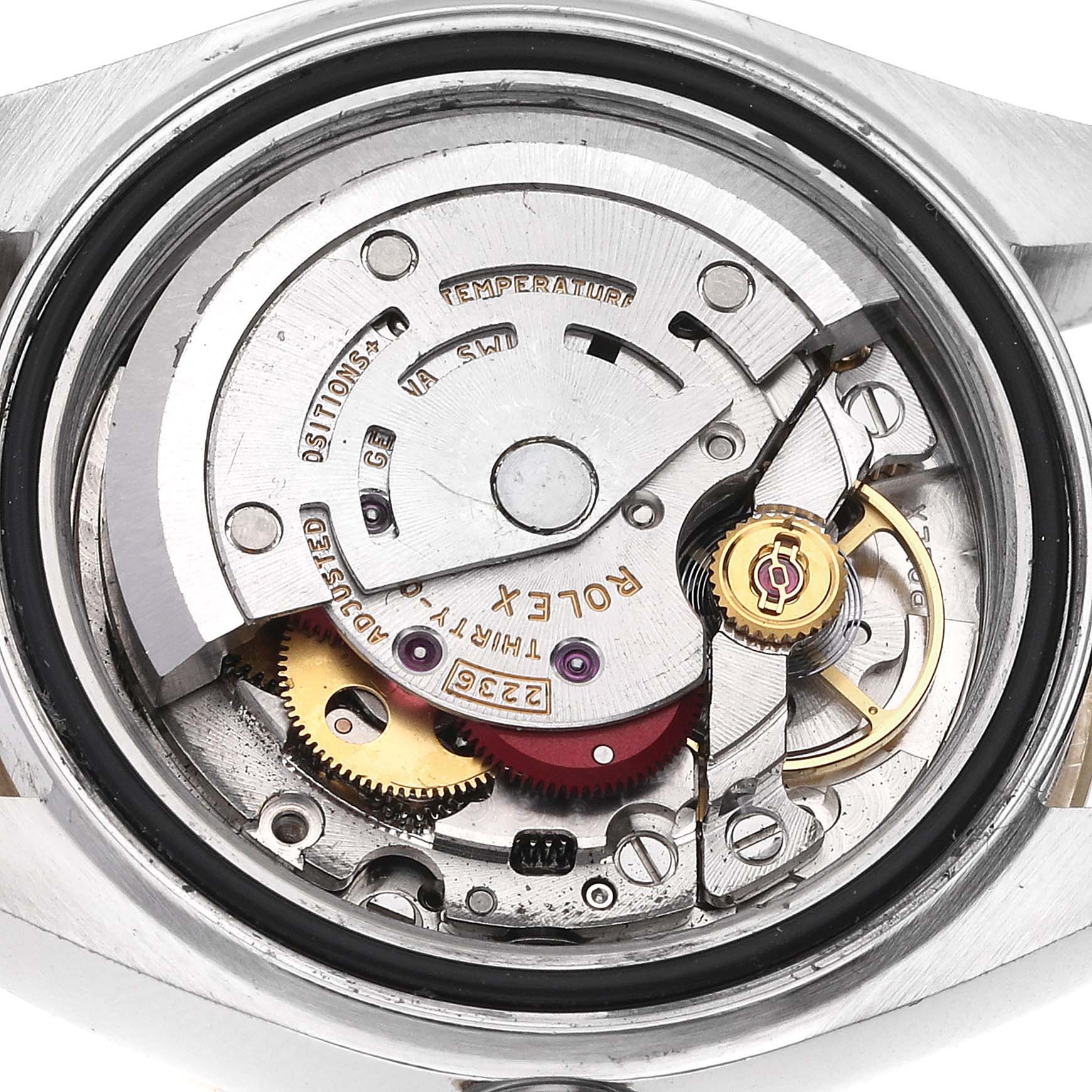 This is an inside view of a Rolex Datejust 279383 Women's Steel and Gold (two tone) Champagne Dial 279383 Women's Steel and Gold (two tone) Champagne Dial watch, showing its intricate internal mechanism and movement components.