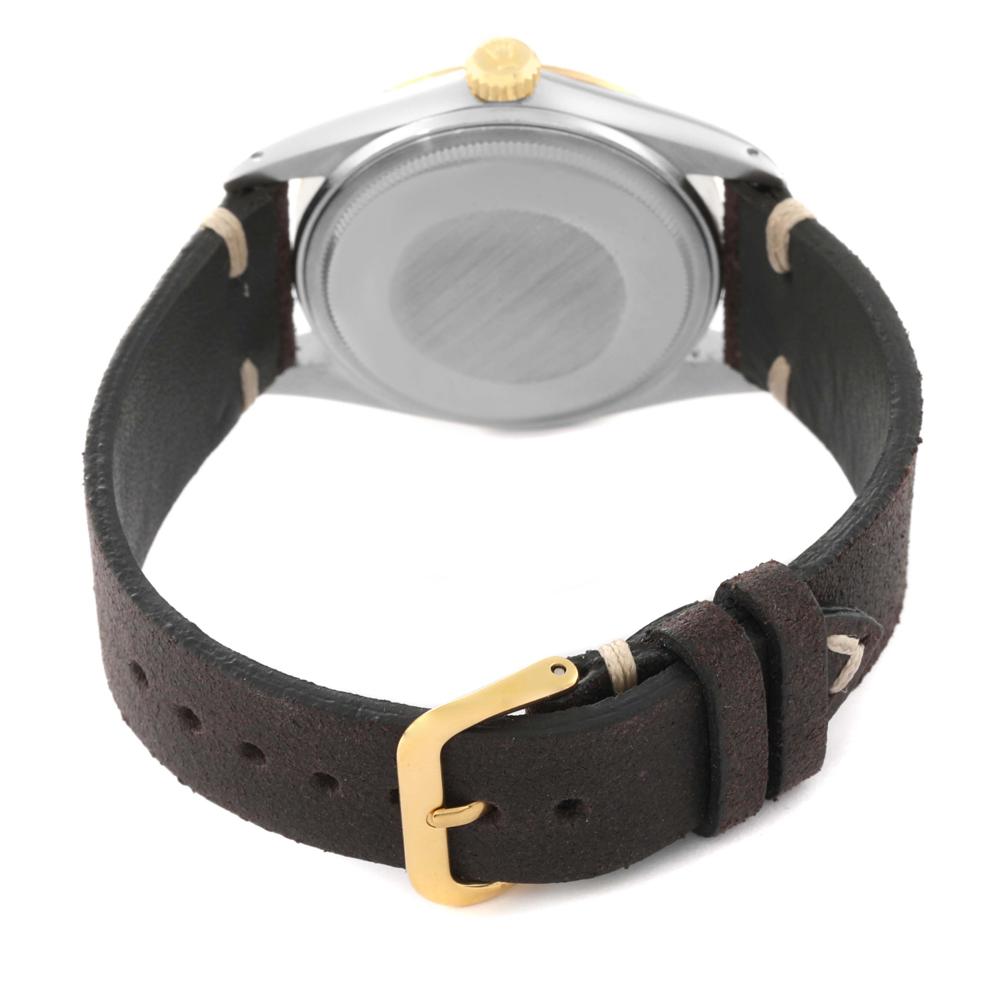 The image shows the back of the Rolex Vintage Collection 16013 Men's Steel and Gold (two tone) Champagne Dial 16013 Men's Steel and Gold (two tone) Champagne Dial watch, highlighting the case back, leather strap, and buckle.