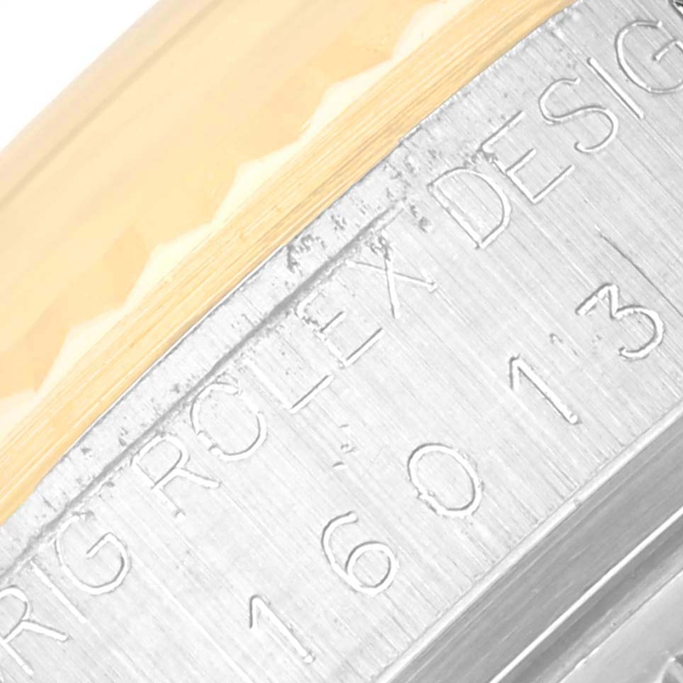 This close-up image shows the engraved model number and bezel of the Rolex Vintage Collection 16013 Men's Steel and Gold (two tone) Champagne Dial 16013 Men's Steel and Gold (two tone) Champagne Dial watch.