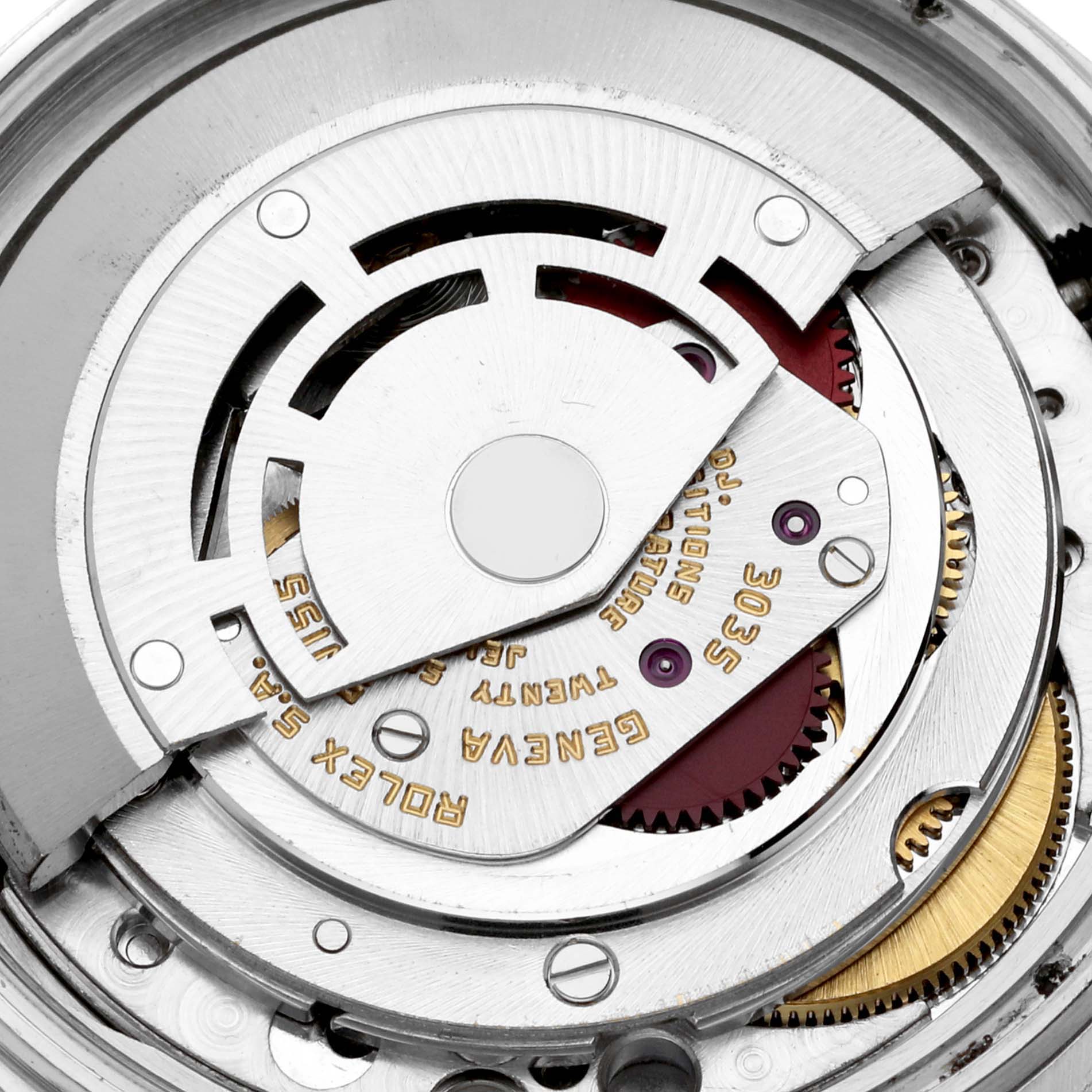 This close-up shows the intricate internal mechanism of a Rolex Vintage Collection 16013 Men's Steel and Gold (two tone) Champagne Dial 16013 Men's Steel and Gold (two tone) Champagne Dial watch, highlighting gears and engraved components.