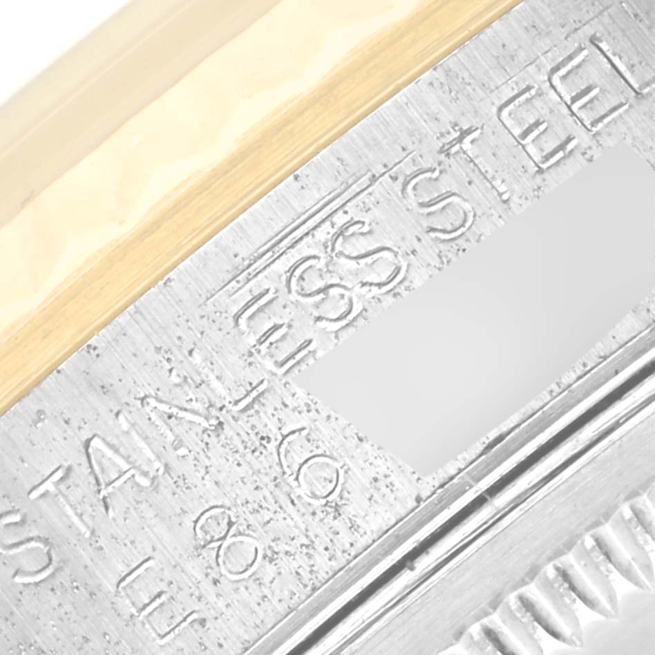 This is a close-up angle showing the engraved stainless steel markings on the Rolex Datejust 16233 Men's Steel and Gold (two tone) Beige Dial 16233 Men's Steel and Gold (two tone) Beige Dial watch.