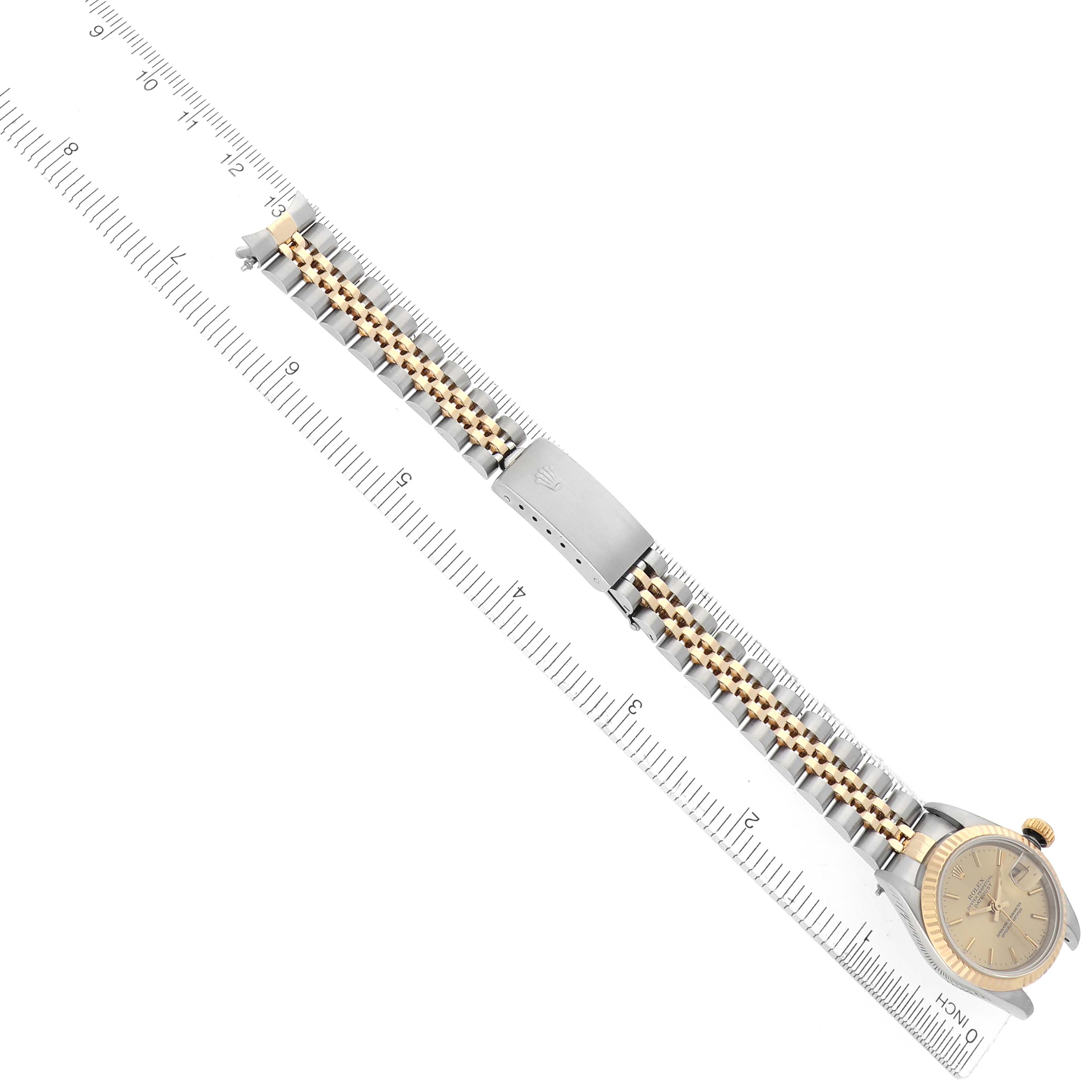 The Rolex Datejust 69173 Women
s Steel and Gold (two tone) Champagne Dial 69173 Women
s Steel and Gold (two tone) Champagne Dial watch is shown at a diagonal angle, highlighting the bracelet, clasp, and part of the dial.