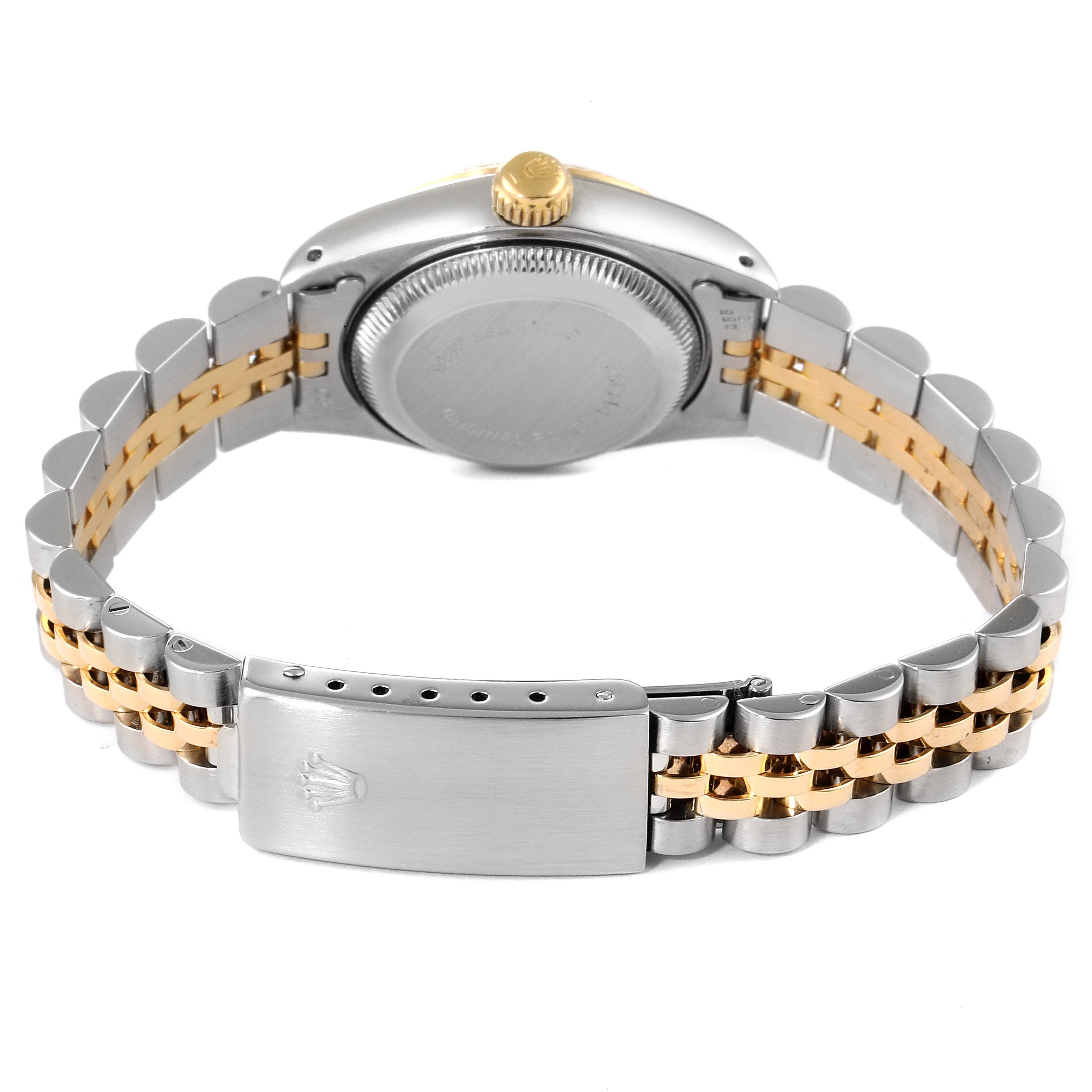 The image shows the back view of a Rolex Datejust 69173 Women
s Steel and Gold (two tone) Mother of Pearl Dial 69173 Women
s Steel and Gold (two tone) Mother of Pearl Dial watch, highlighting its two-tone stainless steel and gold bracelet and clasp.