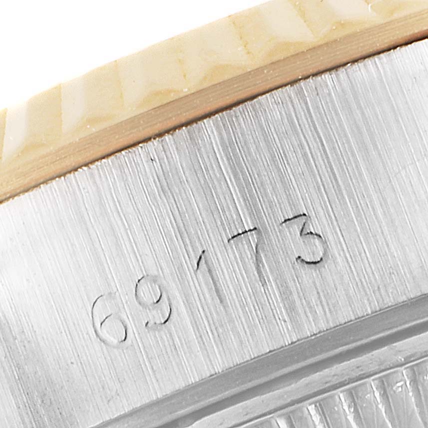 Close-up of the Rolex Datejust 69173 Women
s Steel and Gold (two tone) Mother of Pearl Dial 69173 Women
s Steel and Gold (two tone) Mother of Pearl Dial model showing the engraved serial number "69173" on the case.