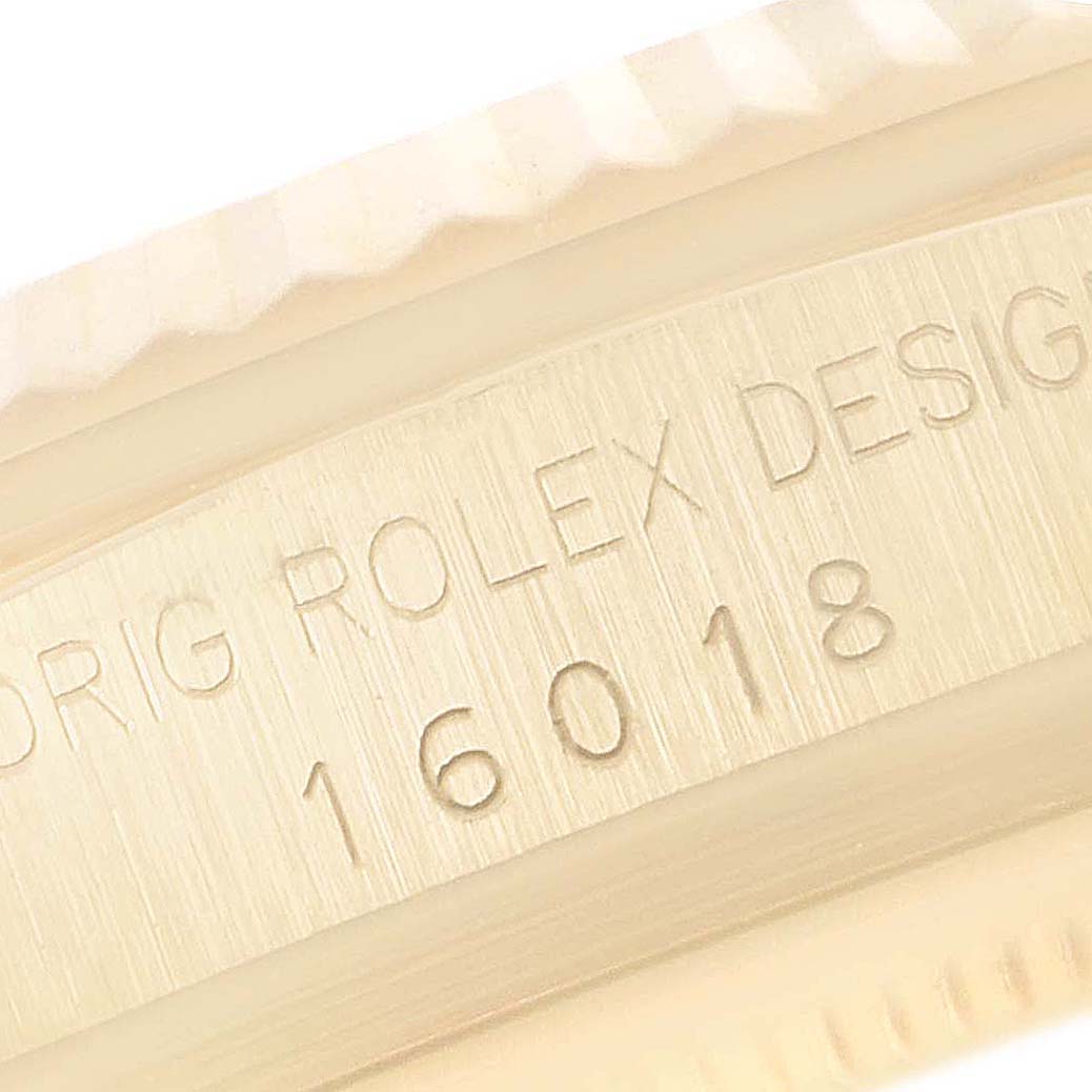 The image shows a close-up of the serial number and engraving on the case side of a Rolex President 16018 Men's Yellow Gold Brown Dial 16018 Men's Yellow Gold Brown Dial model watch.