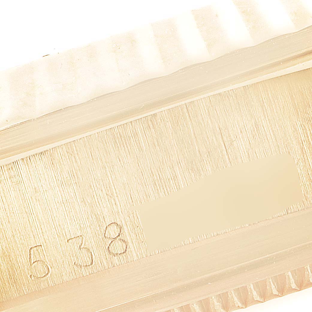 The image shows a close-up of the side with serial and reference numbers of a President model Rolex watch.