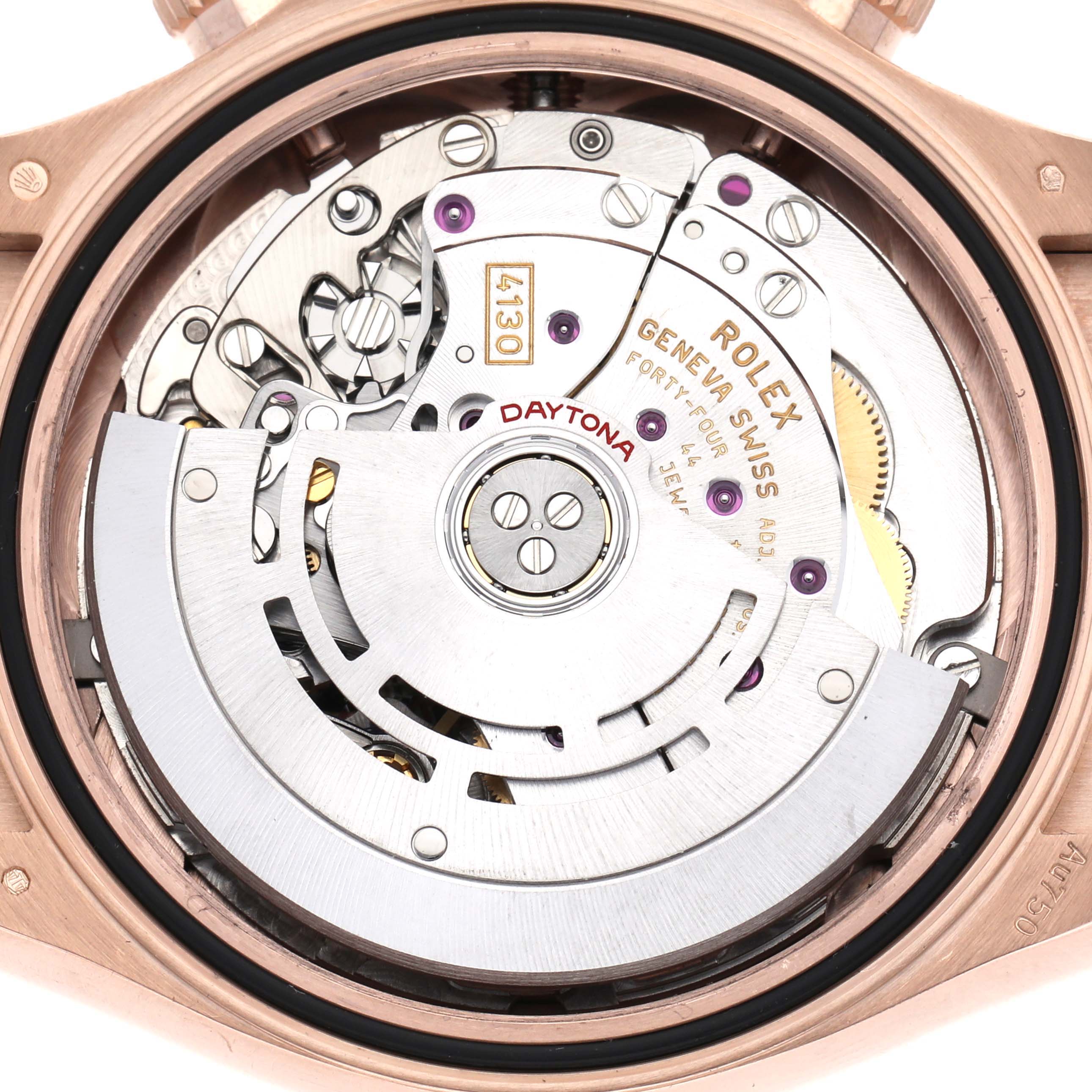 The image shows a Rolex Daytona 116515 Men's Rose Gold Brown Dial 116515 Men's Rose Gold Brown Dial watch movement from a back angle, highlighting the rotor and intricate gears.