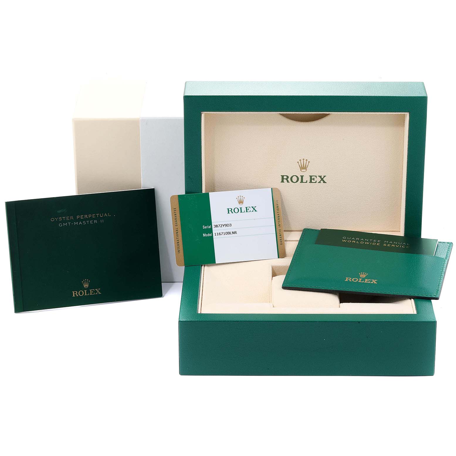 The image shows the packaging and accessories for a Rolex GMT-Master 116710  Men
s Stainless Steel Black Dial 116710  Men
s Stainless Steel Black Dial, including the box, manuals, and warranty card.