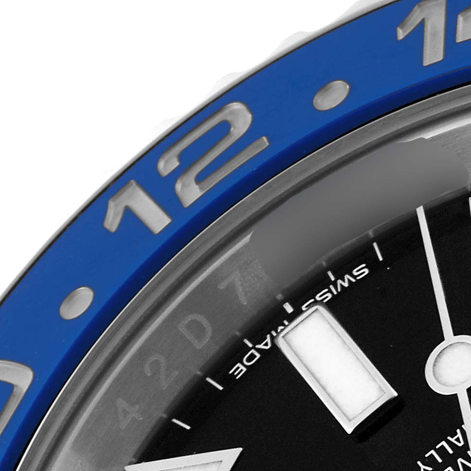 This close-up angle of the Rolex GMT-Master 116710 Men's Stainless Steel Black Dial 116710 Men's Stainless Steel Black Dial watch shows the bezel and part of the dial.