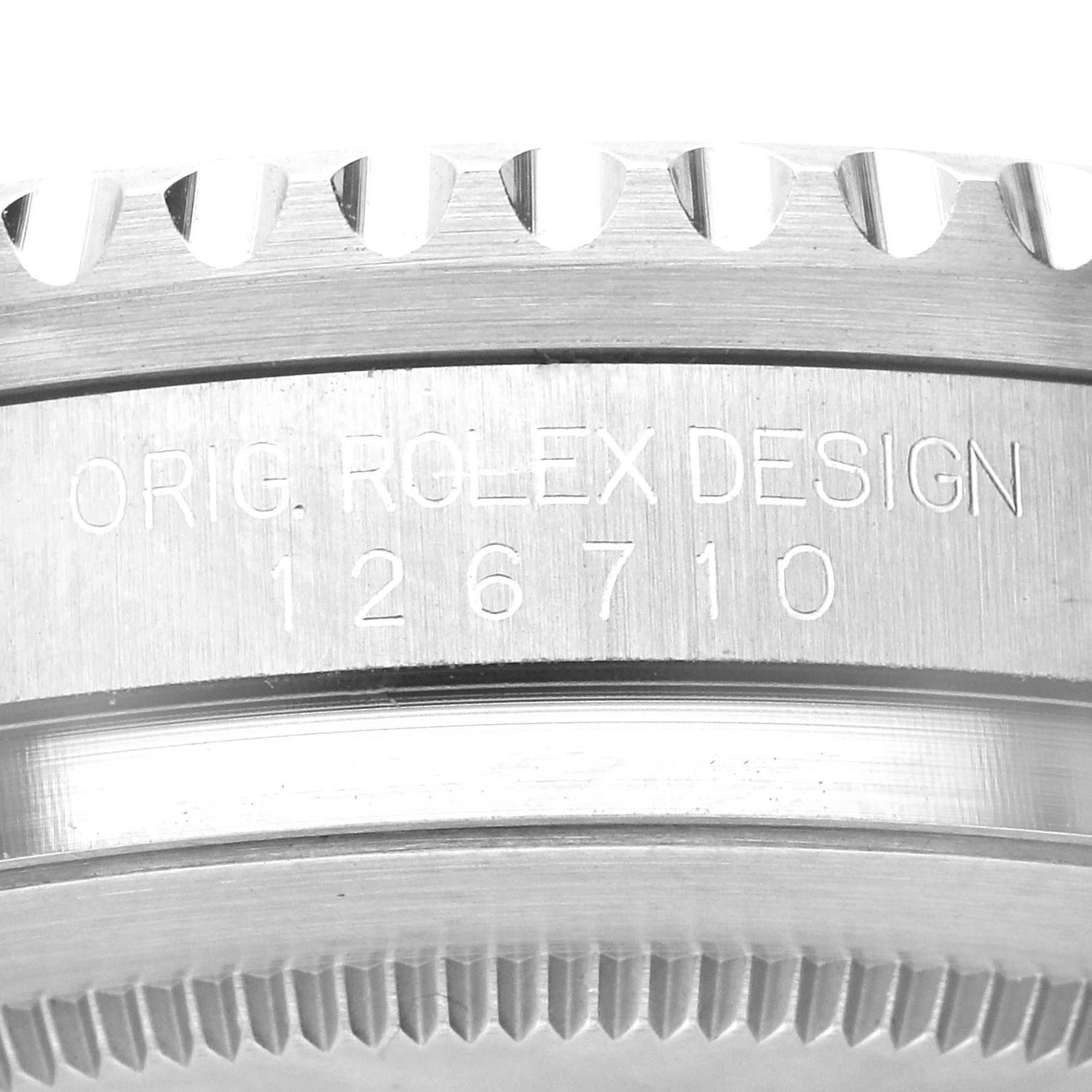 This image shows a close-up view of the case side of a Rolex GMT-Master 126710 Men's Stainless Steel Black Dial 126710 Men's Stainless Steel Black Dial watch, displaying the engraved inscription and model number.