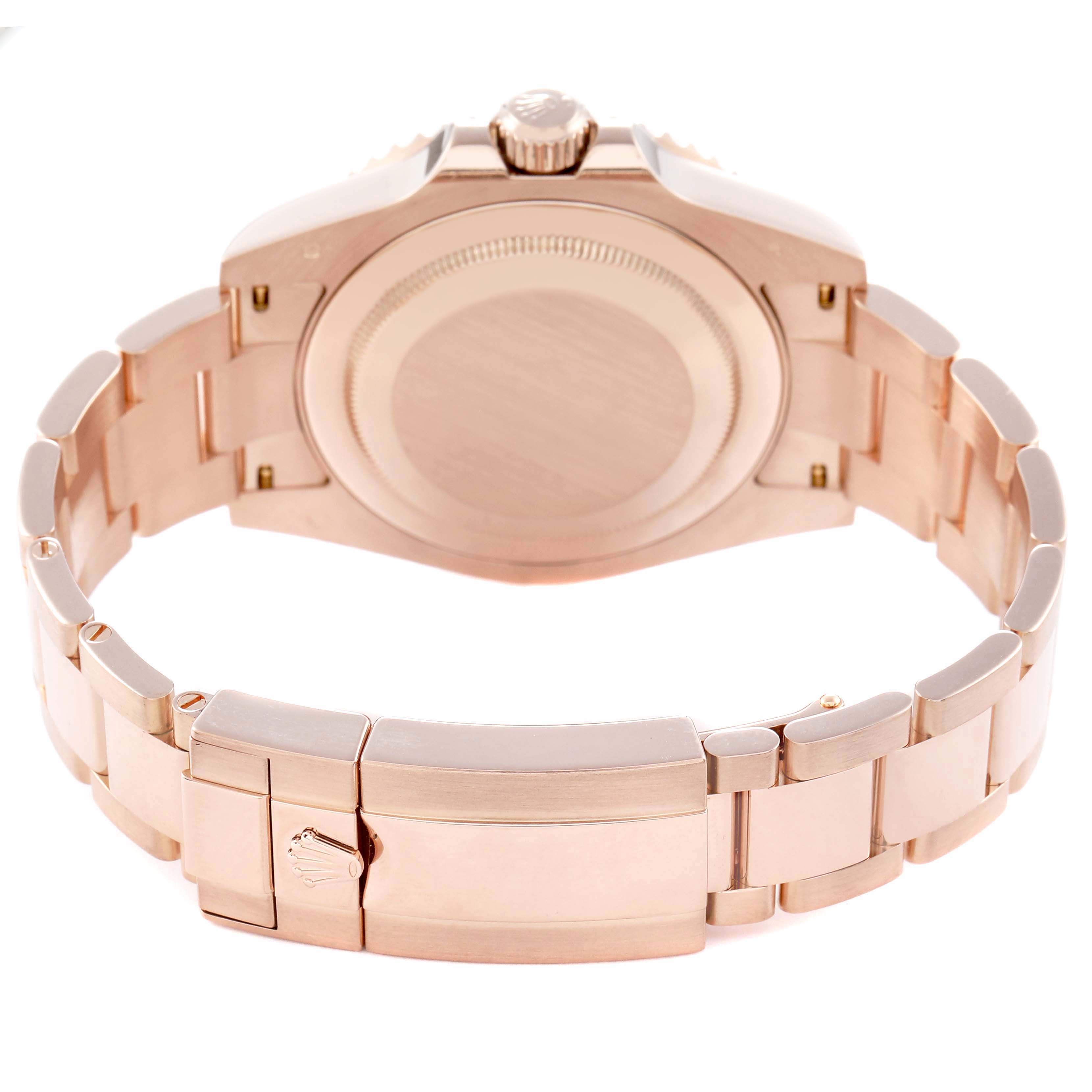 The image shows the back and clasp of a Rolex GMT-Master 126715CHNR Men
s Rose Gold Black Dial 126715CHNR Men
s Rose Gold Black Dial, highlighting the bracelet and case back.