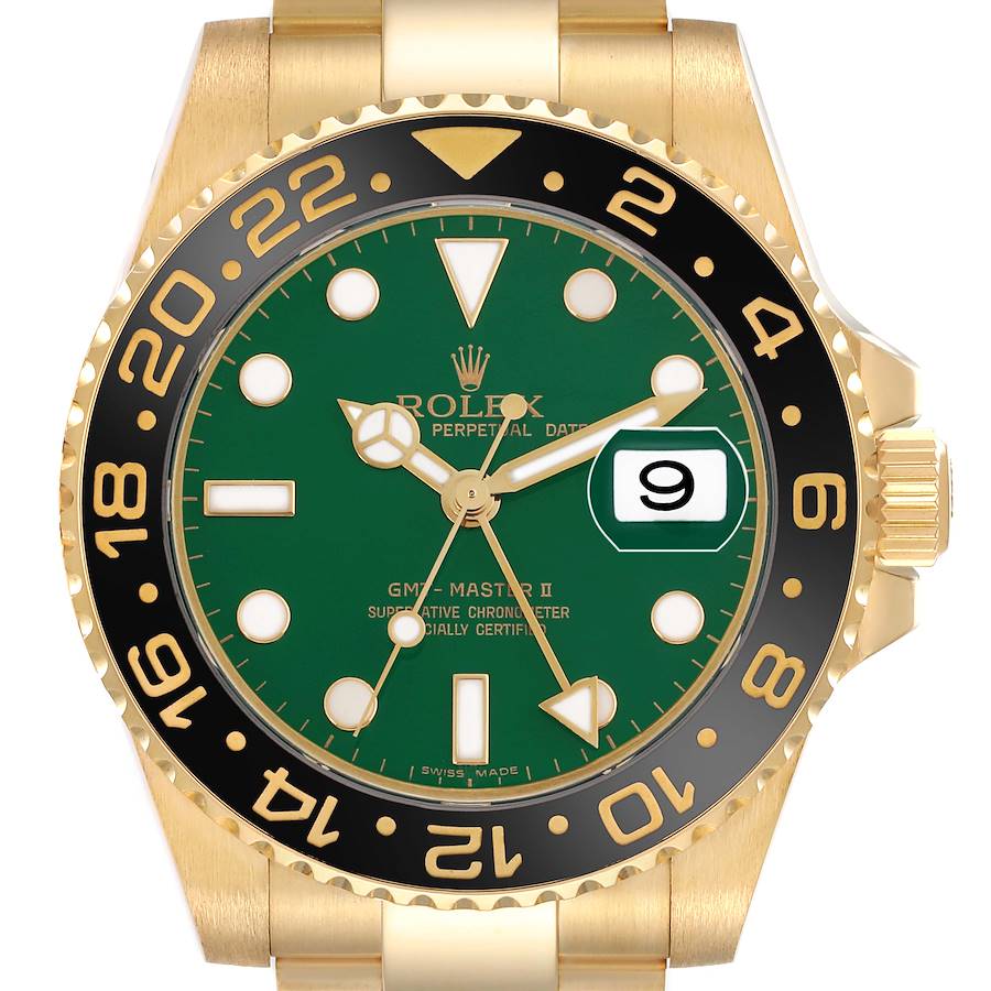 The Rolex GMT-Master watch is shown from the front, highlighting its green dial, gold case, and black bezel with gold numerals.