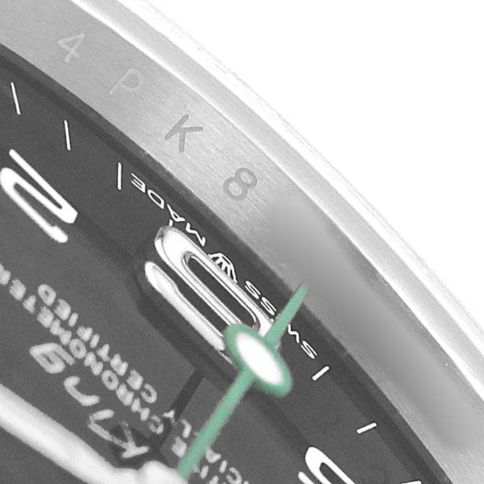 The image shows a close-up of the Rolex Air-King 126900 Men's Stainless Steel Black Dial watch’s dial edge, including the “Swiss Made” text and minute markers.
