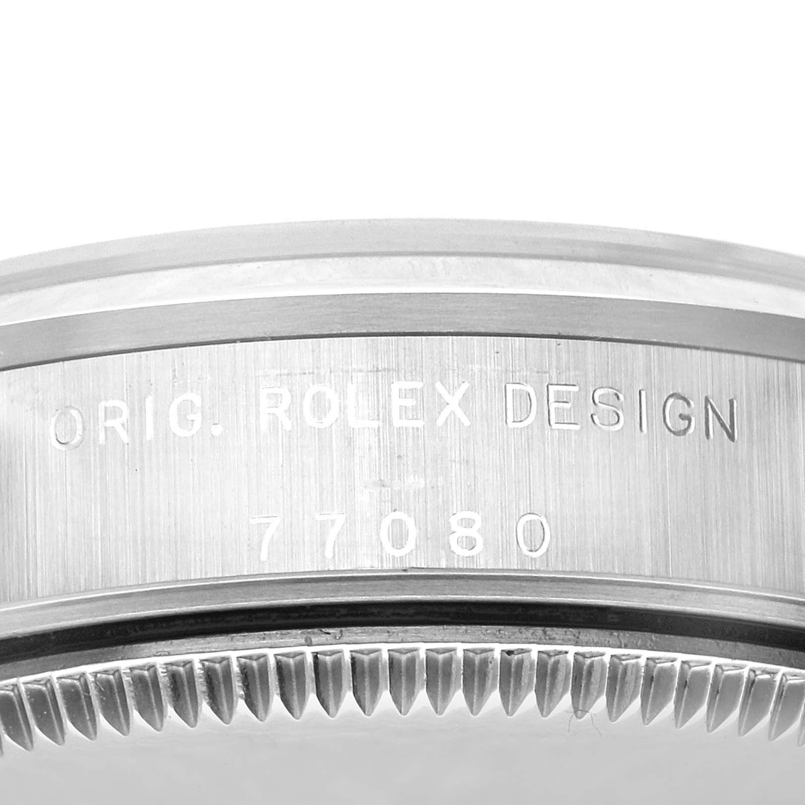 The image shows a close-up of the case side of a Mid-Size Rolex watch, revealing the model number "77080" and "ORIG. ROLEX DESIGN" engraving.
