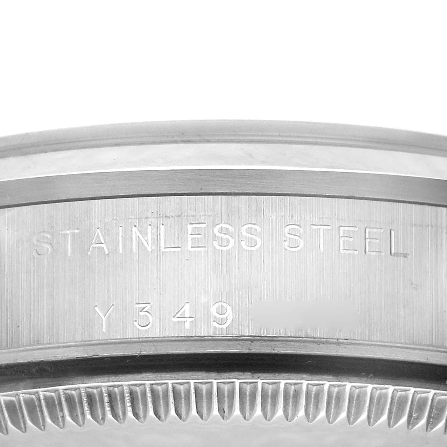The image shows a close-up of the case side and bezel of a Rolex Mid-Size 77080 Women's Stainless Steel Black Dial 77080 Women's Stainless Steel Black Dial watch, indicating it's made of stainless steel.