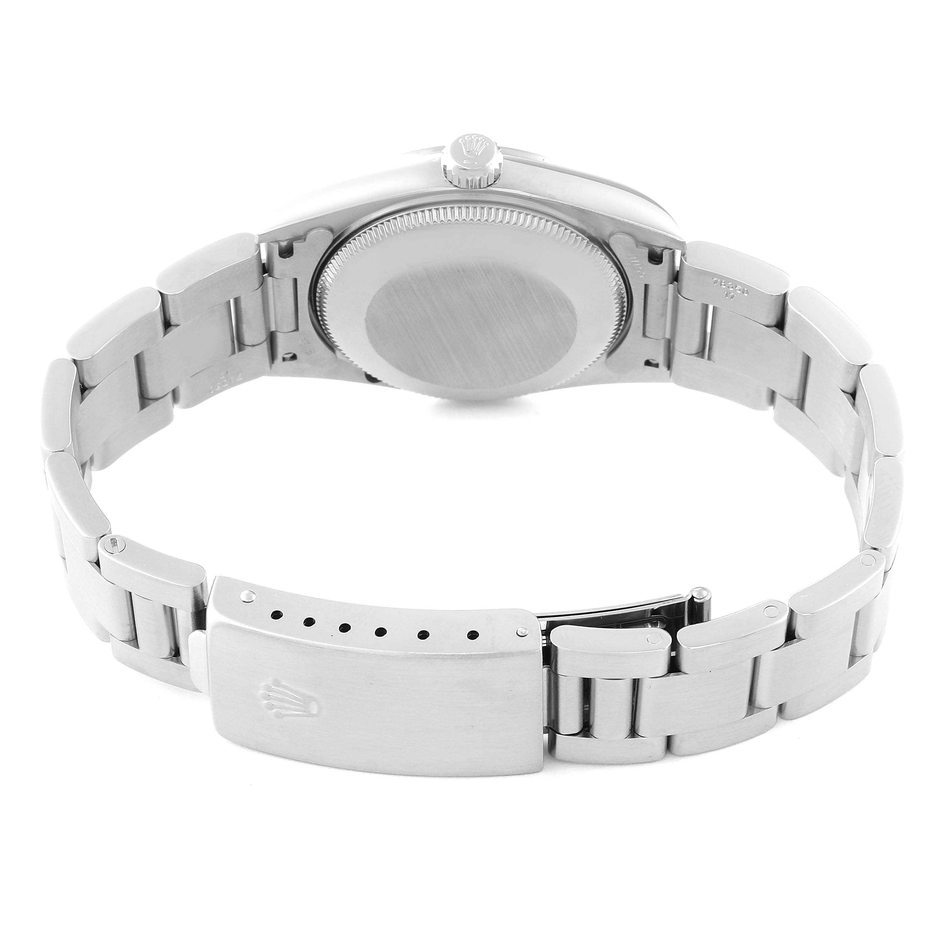 This image shows the back case and clasp of a Mid-Size Rolex watch from a rear angle.