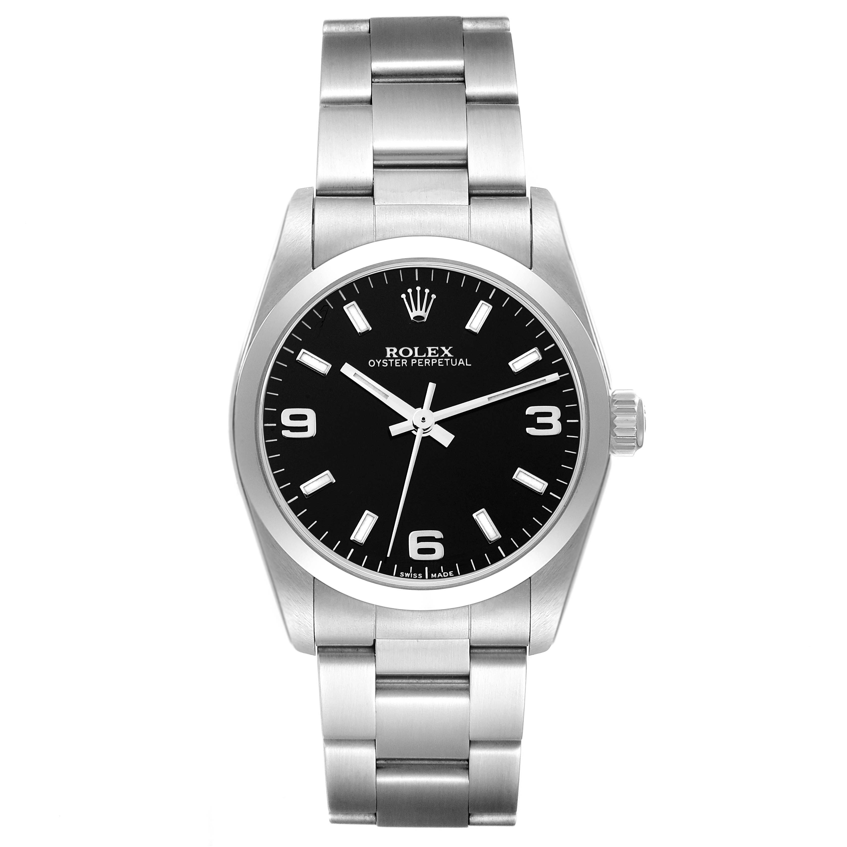 The image shows a front view of a Rolex Oyster Perpetual Mid-Size watch with a black dial and silver stainless steel bracelet.