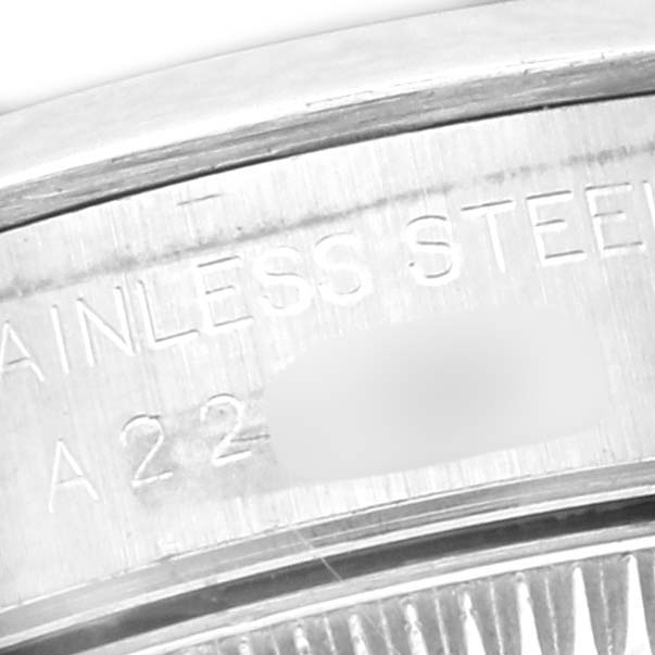 The image shows a close-up of the case side of a Rolex Oyster Perpetual 76080 Women
s Stainless Steel Pink Dial 76080 Women
s Stainless Steel Pink Dial, highlighting the stainless steel material inscription.