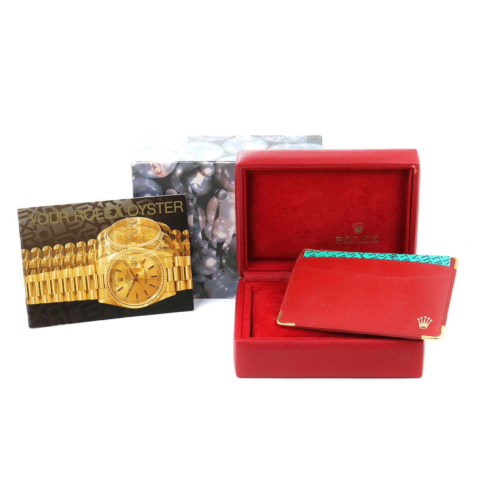 The image displays the box, booklet, and cardholder for a Rolex Oyster Perpetual 76243 Women
s Steel and Gold (two tone) Champagne Dial 76243 Women
s Steel and Gold (two tone) Champagne Dial watch, shown from a front angle.