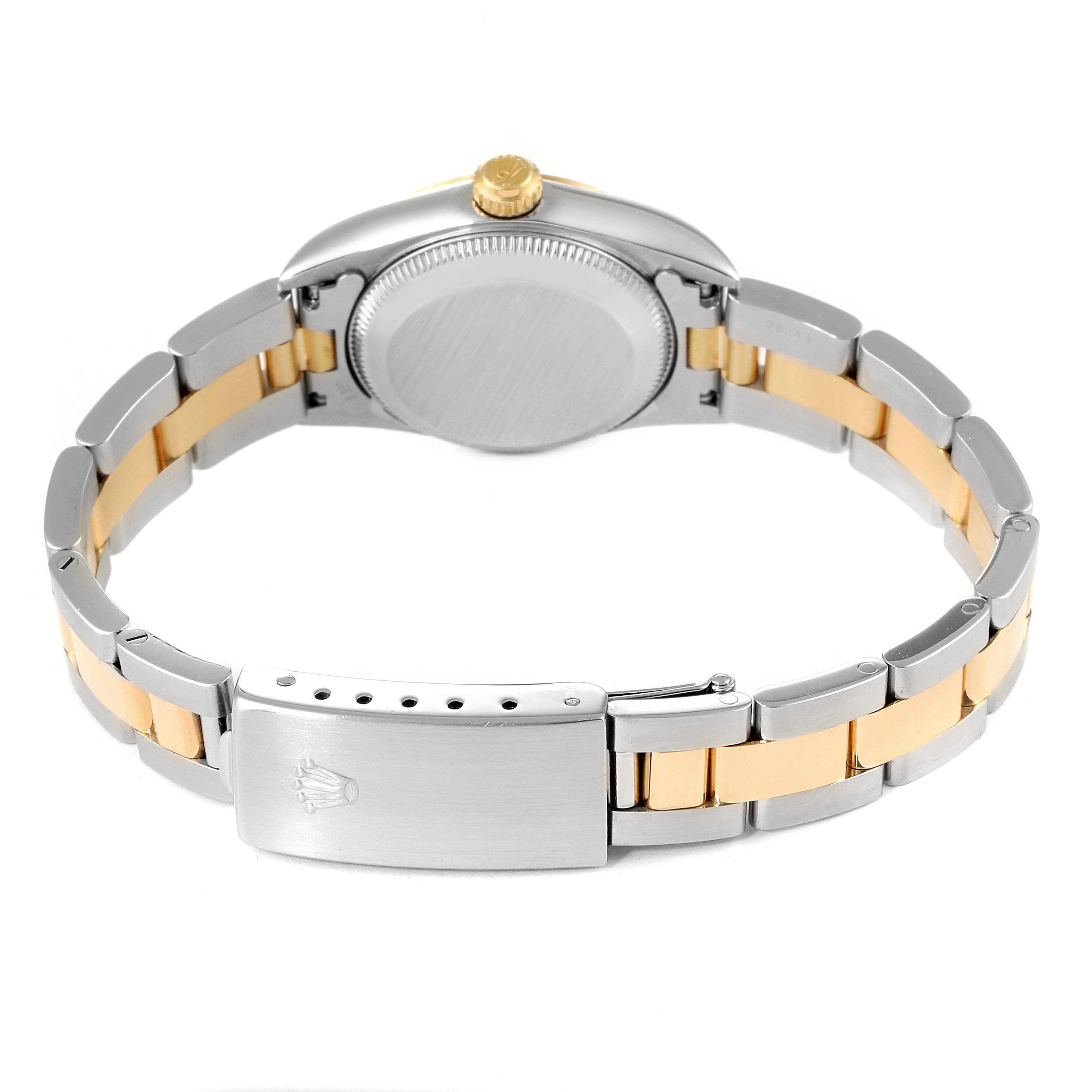 The image shows the back case and band of a Rolex Oyster Perpetual 76243 Women
s Steel and Gold (two tone) Champagne Dial 76243 Women
s Steel and Gold (two tone) Champagne Dial watch from a rear angle.