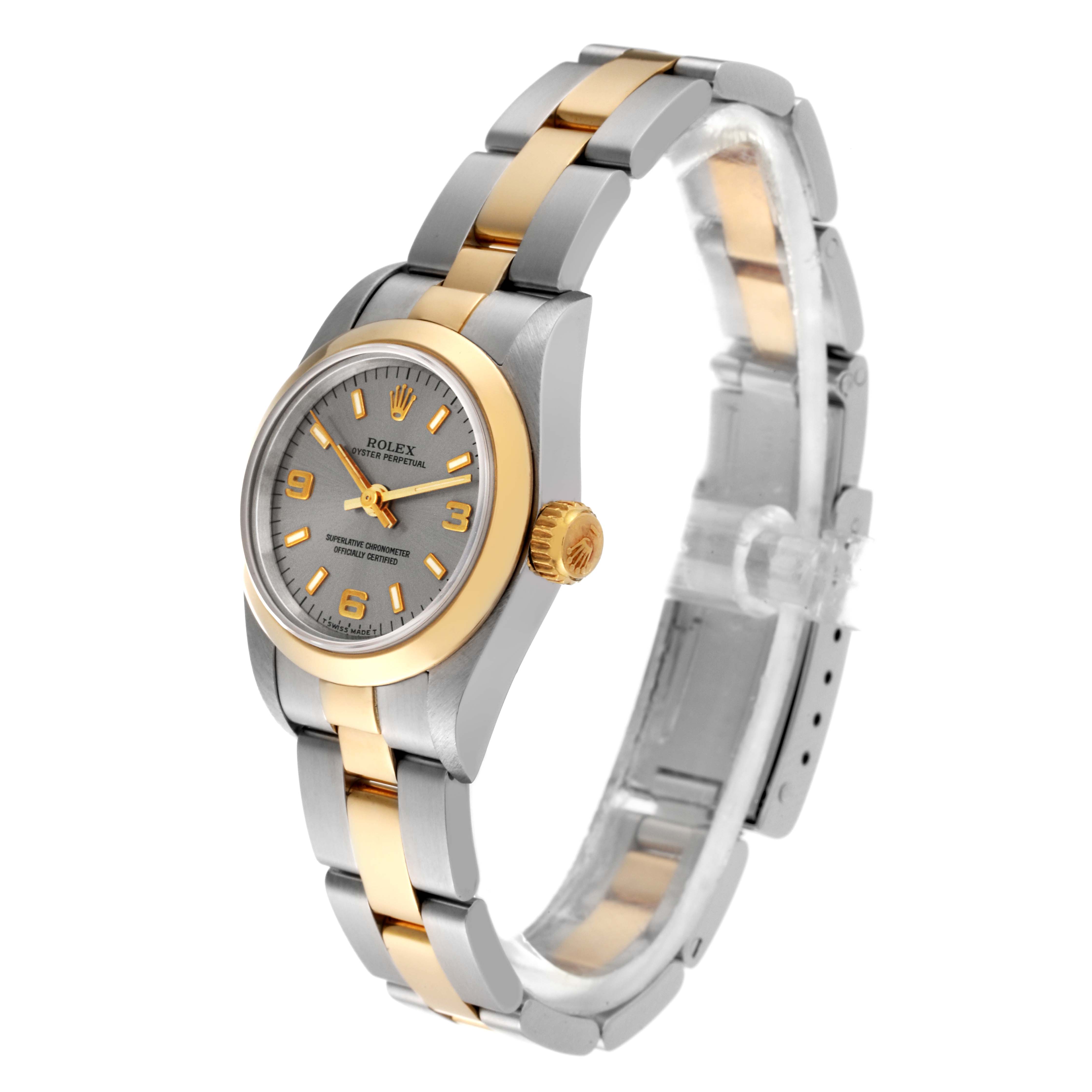 The Rolex Oyster Perpetual 67183 Women's Steel and Gold (two tone) Grey Dial 67183 Women's Steel and Gold (two tone) Grey Dial watch is displayed at a side angle highlighting its dial, bezel, crown, and two-tone bracelet.