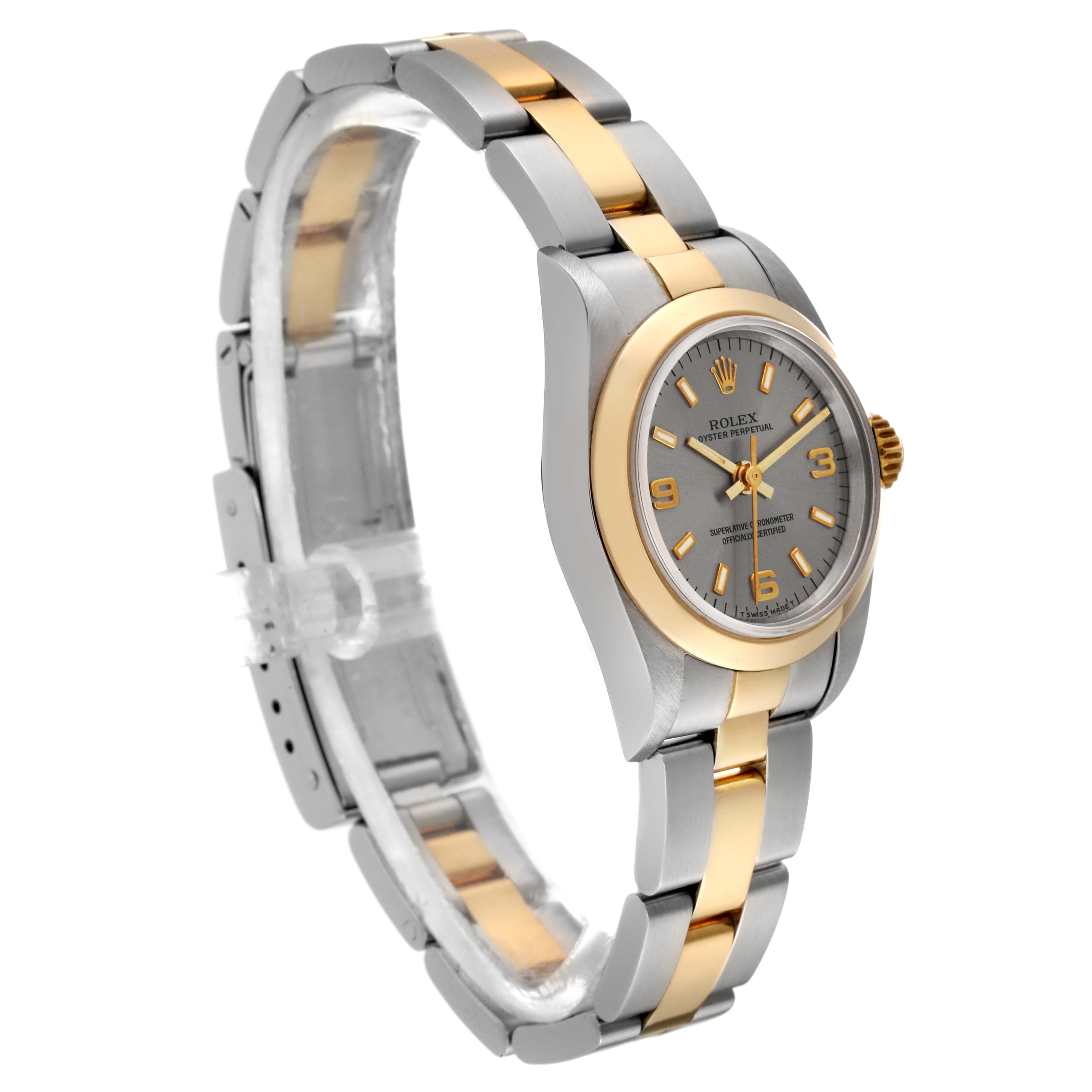 The Rolex Oyster Perpetual 67183 Women's Steel and Gold (two tone) Grey Dial 67183 Women's Steel and Gold (two tone) Grey Dial watch is displayed at a three-quarter angle, showing its two-tone bracelet and dial.