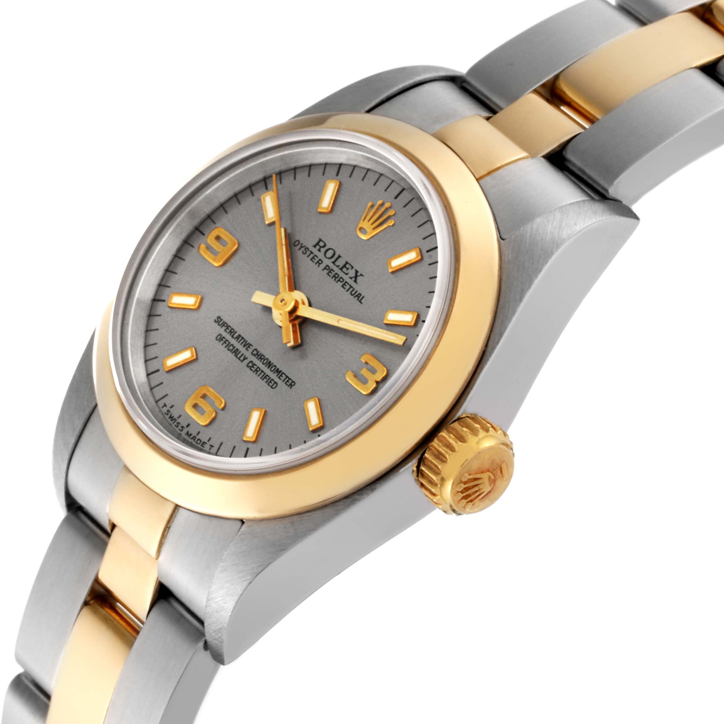 The image shows a side angle of a Rolex Oyster Perpetual 67183 Women's Steel and Gold (two tone) Grey Dial 67183 Women's Steel and Gold (two tone) Grey Dial, highlighting the bezel, crown, and part of the bracelet.