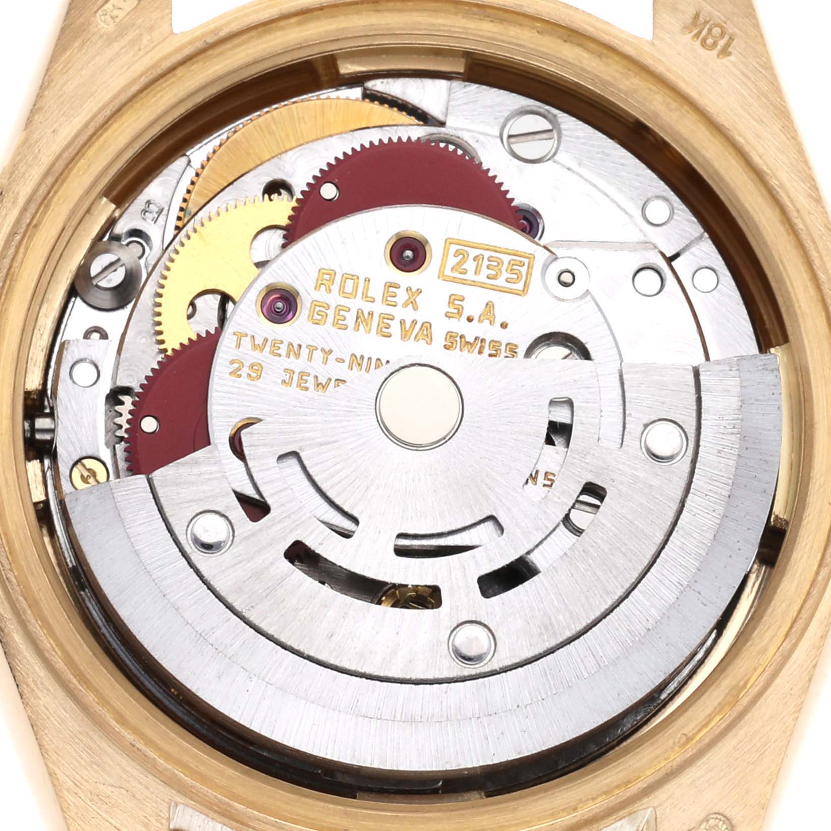 The image shows a close-up of the Rolex President 69178 Women
s Yellow Gold Champagne Dial 69178 Women
s Yellow Gold Champagne Dial model’s movement, displaying gears and inscriptions.