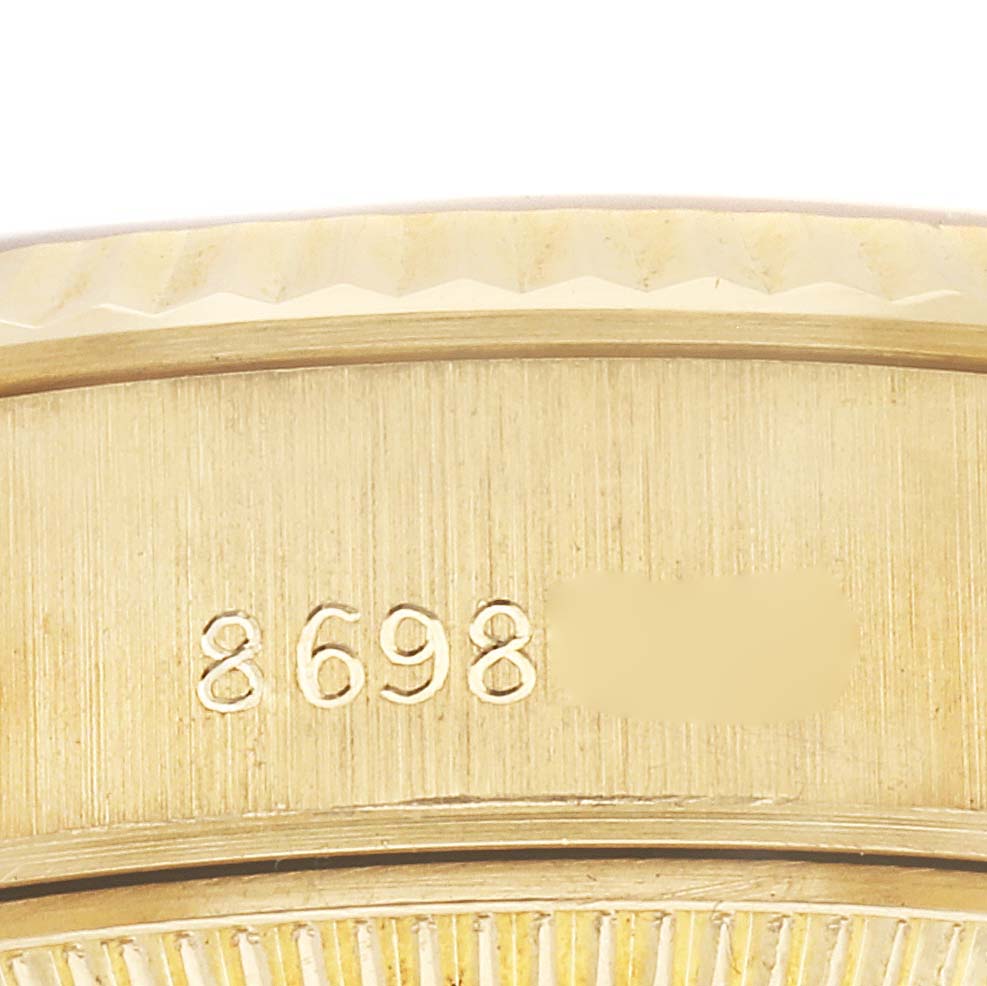The image shows a close-up of the serial number area on the side of a Rolex President 69178 Women
s Yellow Gold Champagne Dial 69178 Women
s Yellow Gold Champagne Dial watch case.