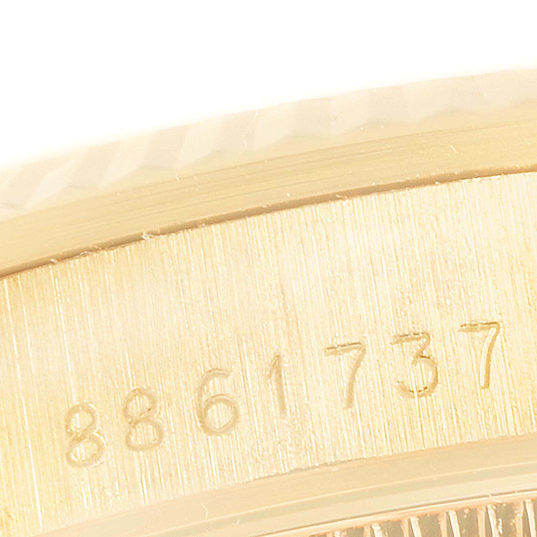 The image shows a close-up of the serial number engraved on the case of a Rolex President 68278 Women
s Yellow Gold Champagne Dial 68278 Women
s Yellow Gold Champagne Dial model watch.