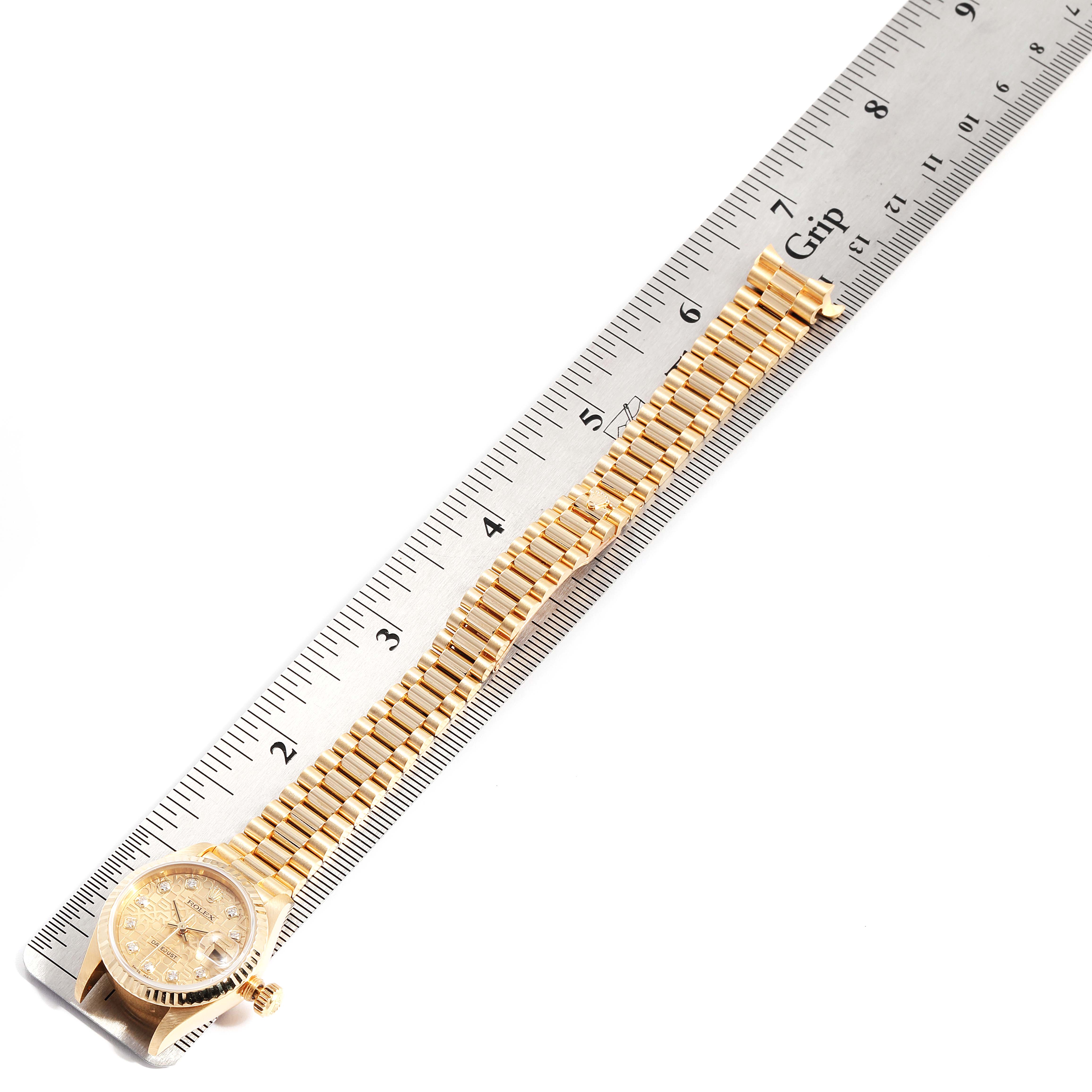 The image shows a side view of a Rolex President 79178 Women
s Yellow Gold Champagne Dial 79178 Women
s Yellow Gold Champagne Dial model watch and its band, placed next to a ruler for measurement.
