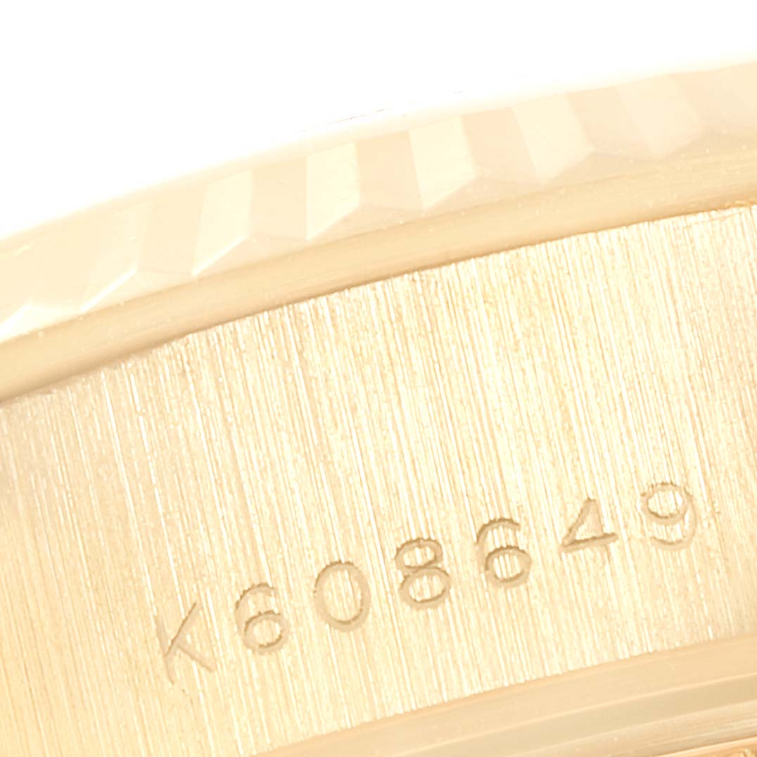 This image shows a close-up of the serial number on the side case of a Rolex President 79178 Women
s Yellow Gold Champagne Dial 79178 Women
s Yellow Gold Champagne Dial watch.