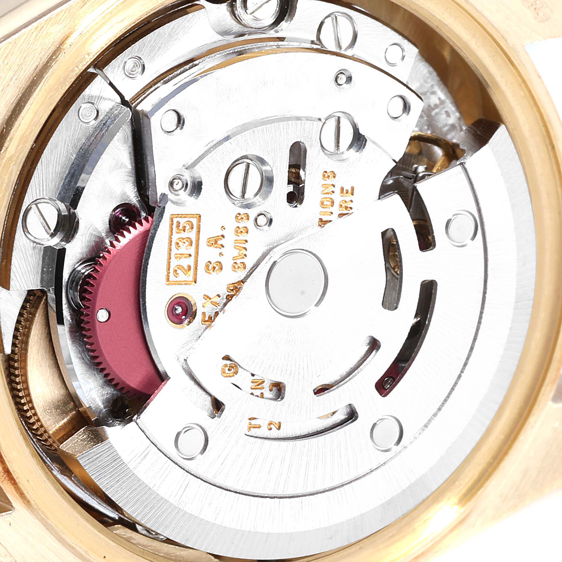 The image shows a close-up of the movement and internal mechanics of a Rolex President 69258 Women
s Yellow Gold Champagne Dial 69258 Women
s Yellow Gold Champagne Dial watch.