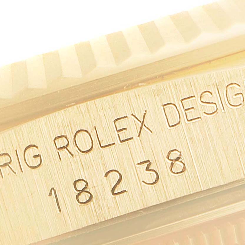 This image shows a close-up of the model number and engraved text on the side of a Rolex President 18238 Men
s Yellow Gold Champagne Dial 18238 Men
s Yellow Gold Champagne Dial watch.