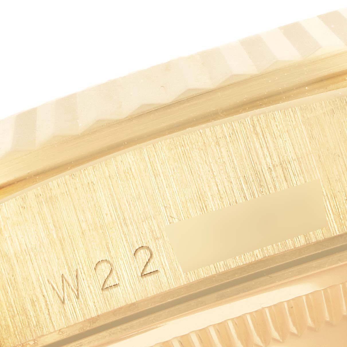 The image shows a close-up of the side case edge of the Rolex President 18238 Men
s Yellow Gold Champagne Dial 18238 Men
s Yellow Gold Champagne Dial model, highlighting the model
s engraving.