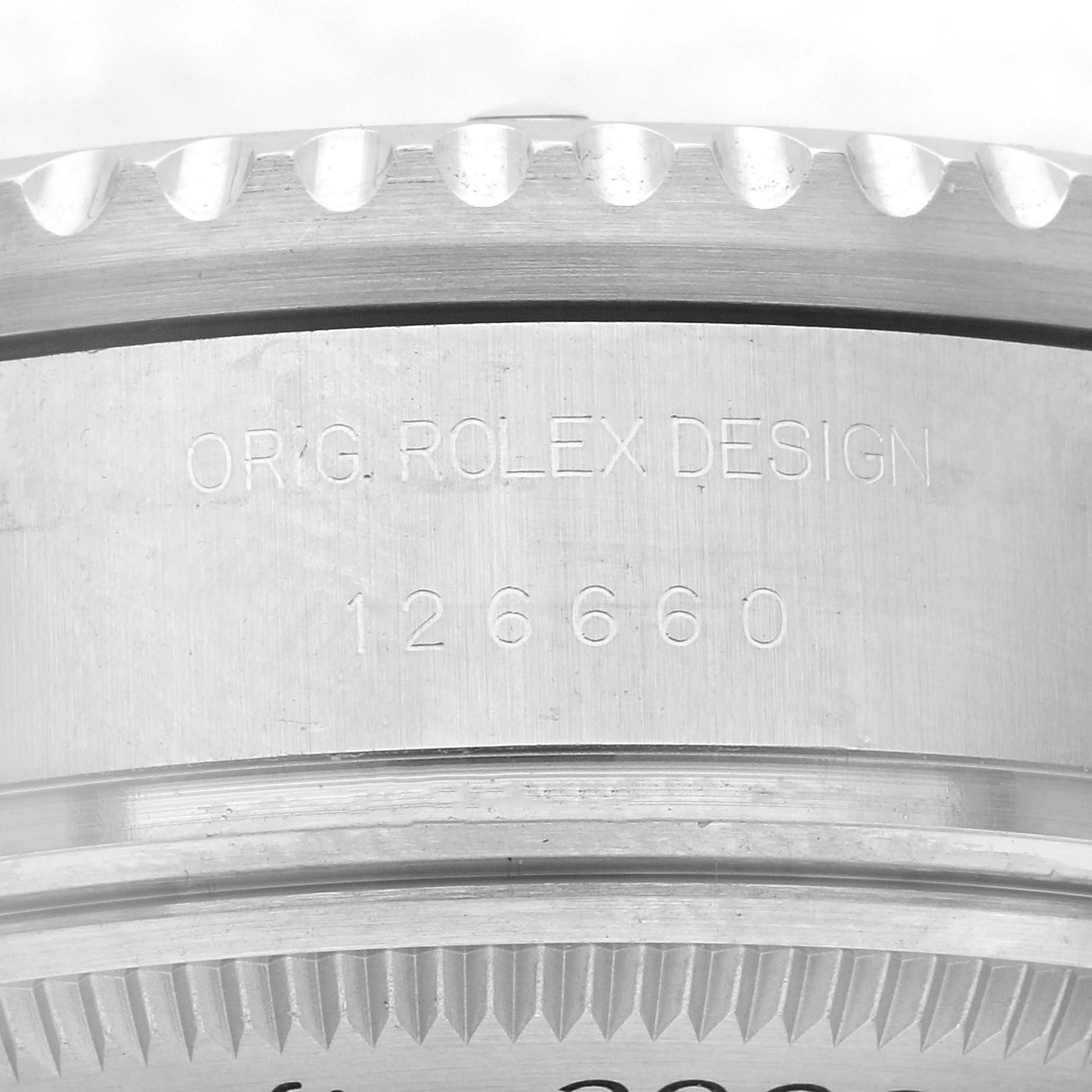 The image shows a close-up of the side of a Rolex Sea-Dweller 126660 Men
s Stainless Steel Blue Dial 126660 Men
s Stainless Steel Blue Dial, focusing on the engraved design and model number "126660."