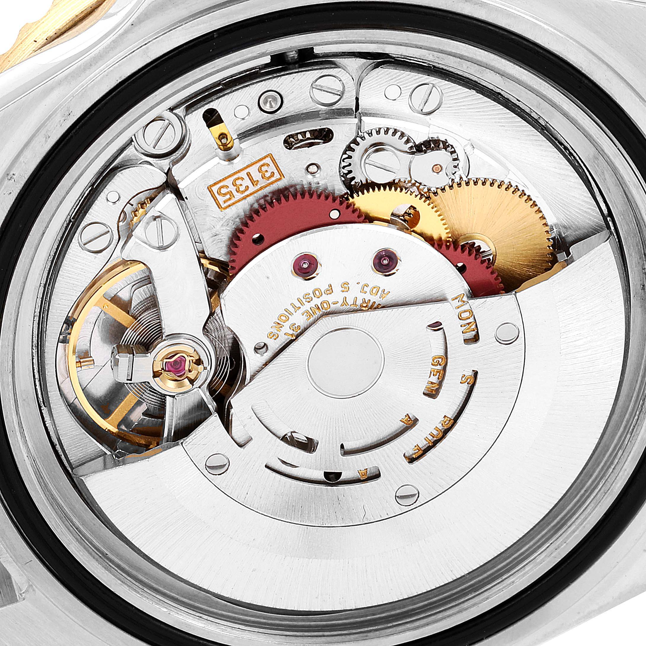 This image shows the internal mechanism and movement of a Rolex Submariner 16613 Men's Steel and Gold (two tone) Black Dial 16613 Men's Steel and Gold (two tone) Black Dial watch viewed from the back.