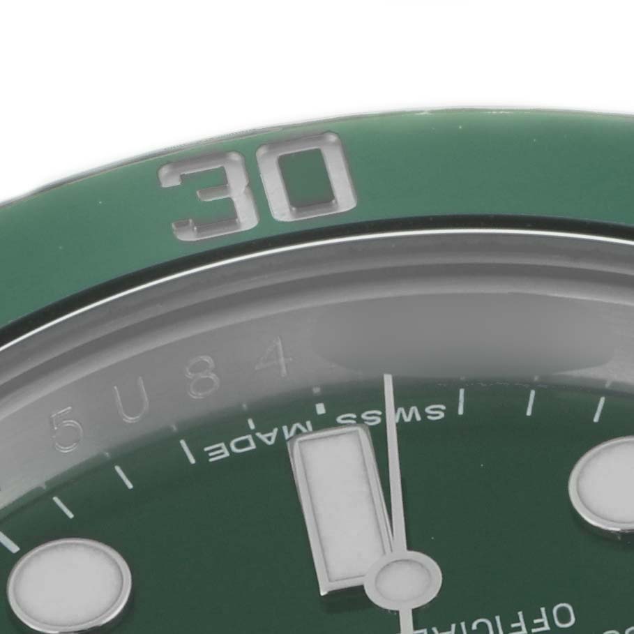 The image shows a close-up of the bezel and dial of a Rolex Submariner 116610LV Men
s Stainless Steel Green Dial 116610LV Men
s Stainless Steel Green Dial, highlighting the 30-minute mark.