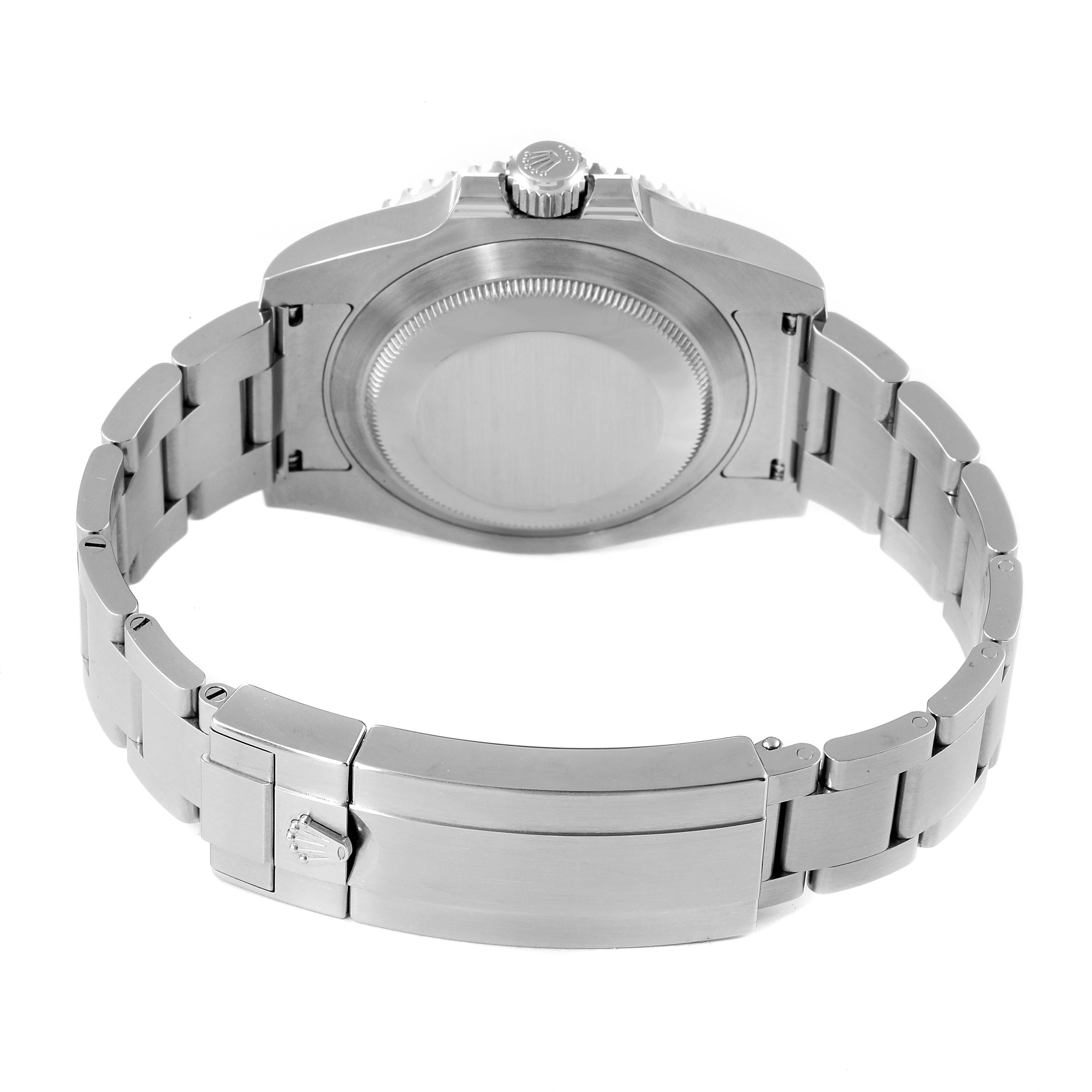 The image shows the back view of a Rolex Submariner 116610LV Men
s Stainless Steel Green Dial 116610LV Men
s Stainless Steel Green Dial watch, focusing on the case back and the bracelet.