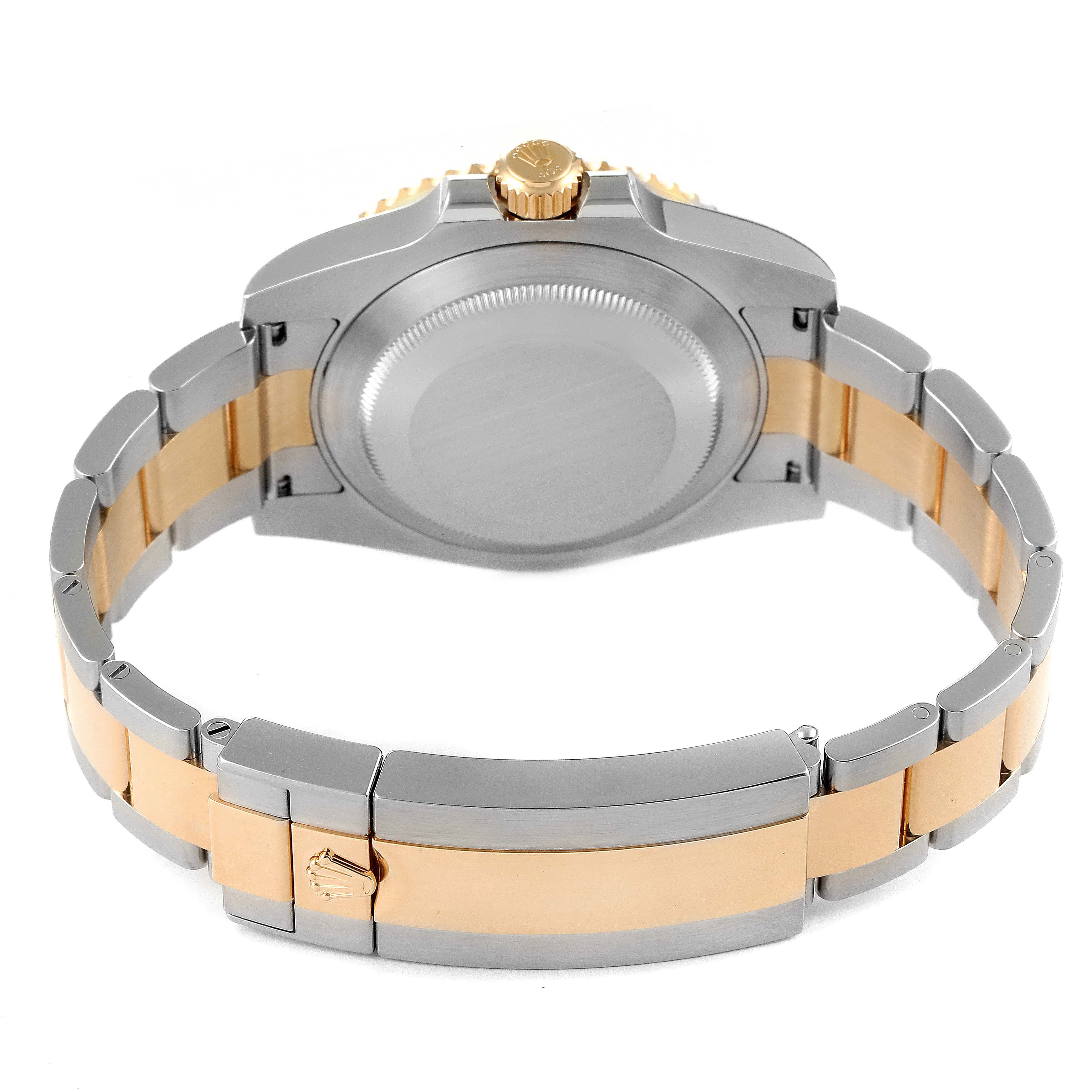 This image shows the back of the Rolex Submariner 116613 Men
s Steel and Gold (two tone) Black Dial 116613 Men
s Steel and Gold (two tone) Black Dial watch, highlighting the case back, bracelet, and clasp.