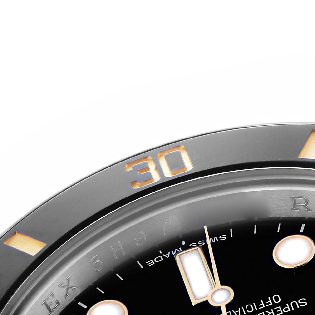The image shows a close-up of the bezel and part of the dial of a Rolex Submariner 116613 Men
s Steel and Gold (two tone) Black Dial 116613 Men
s Steel and Gold (two tone) Black Dial watch, highlighting the "30" minute marker.
