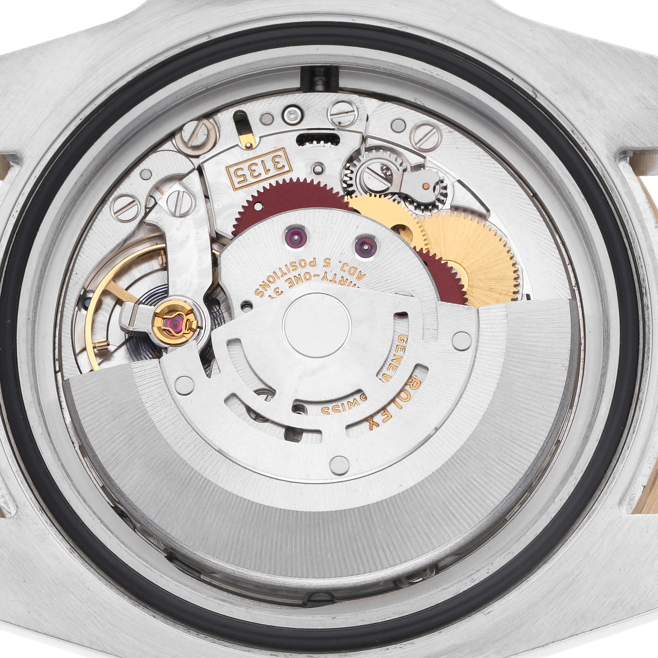 The image shows the case back of the Rolex Submariner 116613 Men
s Steel and Gold (two tone) Black Dial 116613 Men
s Steel and Gold (two tone) Black Dial, displaying its movement and intricate inner workings.