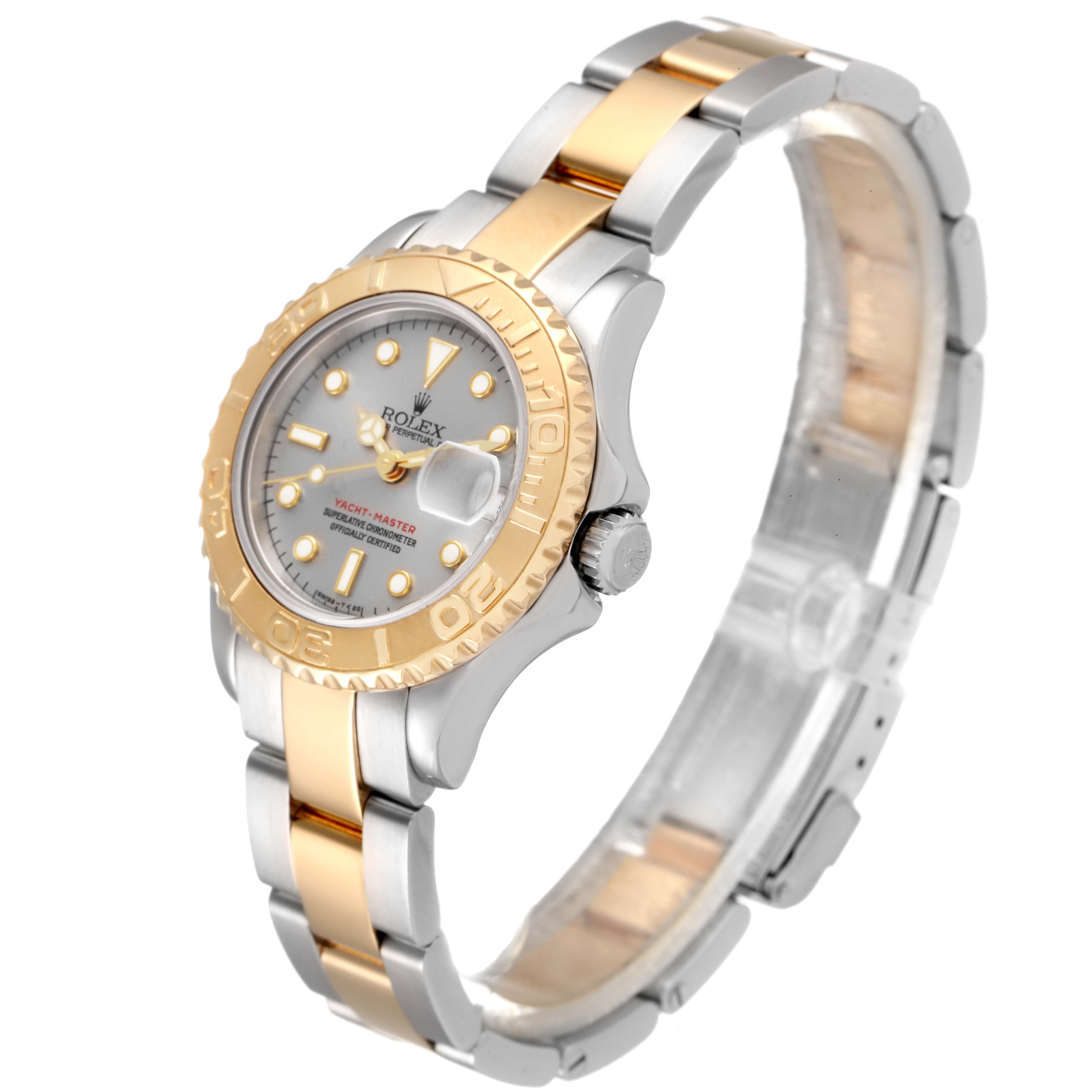 The Yacht-Master Rolex watch is shown from a three-quarter angle, highlighting the face, bezel, and two-tone bracelet.