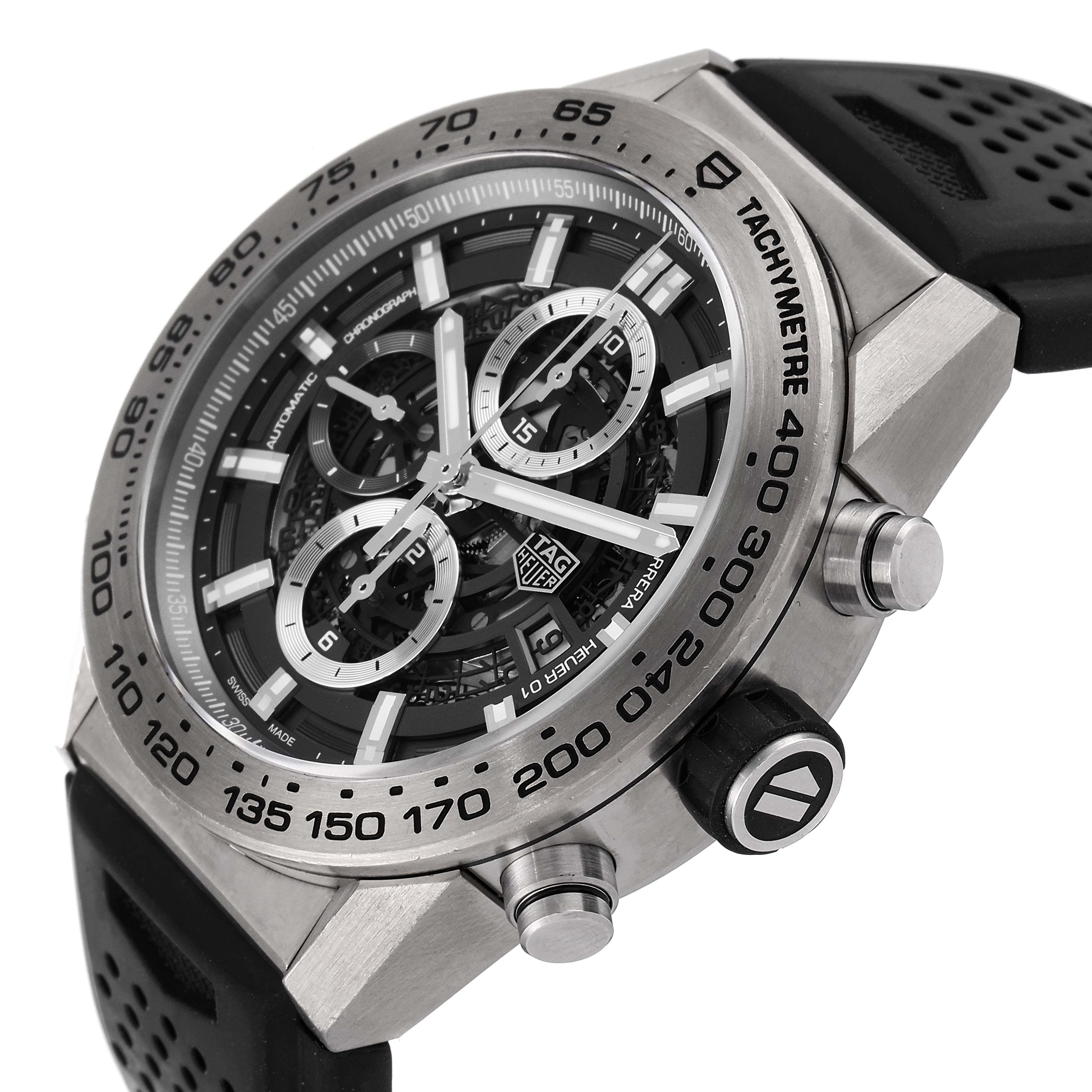 The image shows a close-up, angled view of the Tag Heuer Carrera CAR2A8A.FT6072 Men's Titanium Grey Dial CAR2A8A.FT6072 Men's Titanium Grey Dial watch, highlighting its face, bezel, and chronograph buttons.