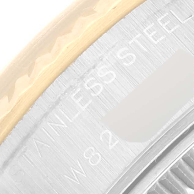 This close-up image of the Rolex Datejust 69173 Women's Steel and Gold (two tone) Blue Dial 69173 Women's Steel and Gold (two tone) Blue Dial shows part of the bezel and engraved "STAINLESS STEEL" text.