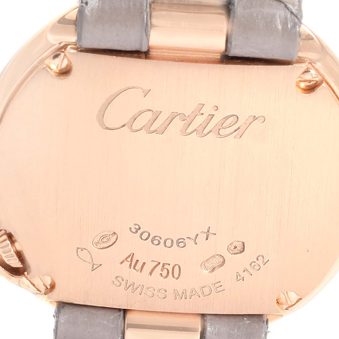 This image shows the case back of the Cartier Ballon Bleu watch, highlighting the engravings and strap attachment.